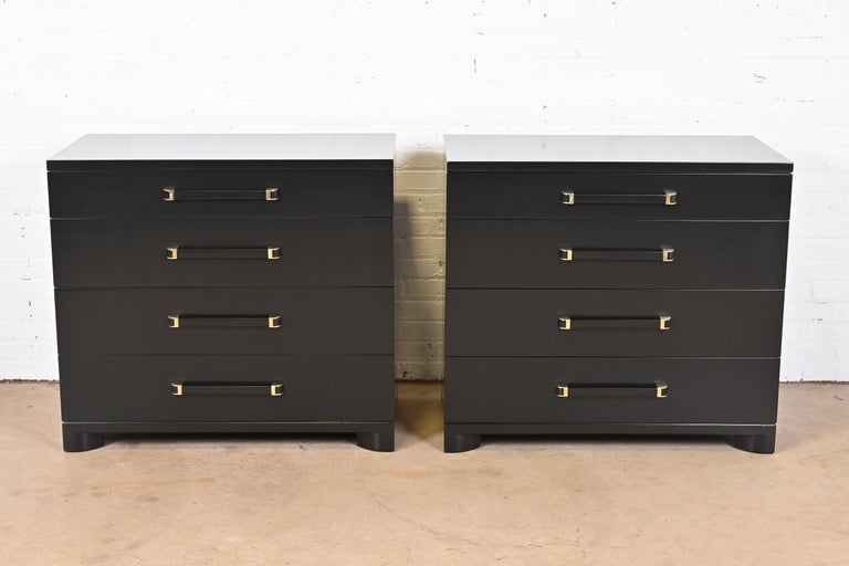 A gorgeous pair of Art Deco or Mid-Century Modern dressers or bedside chests

By John Widdicomb

USA, Circa 1940s

Black lacquered mahogany, with brass accents.

Measures: 36