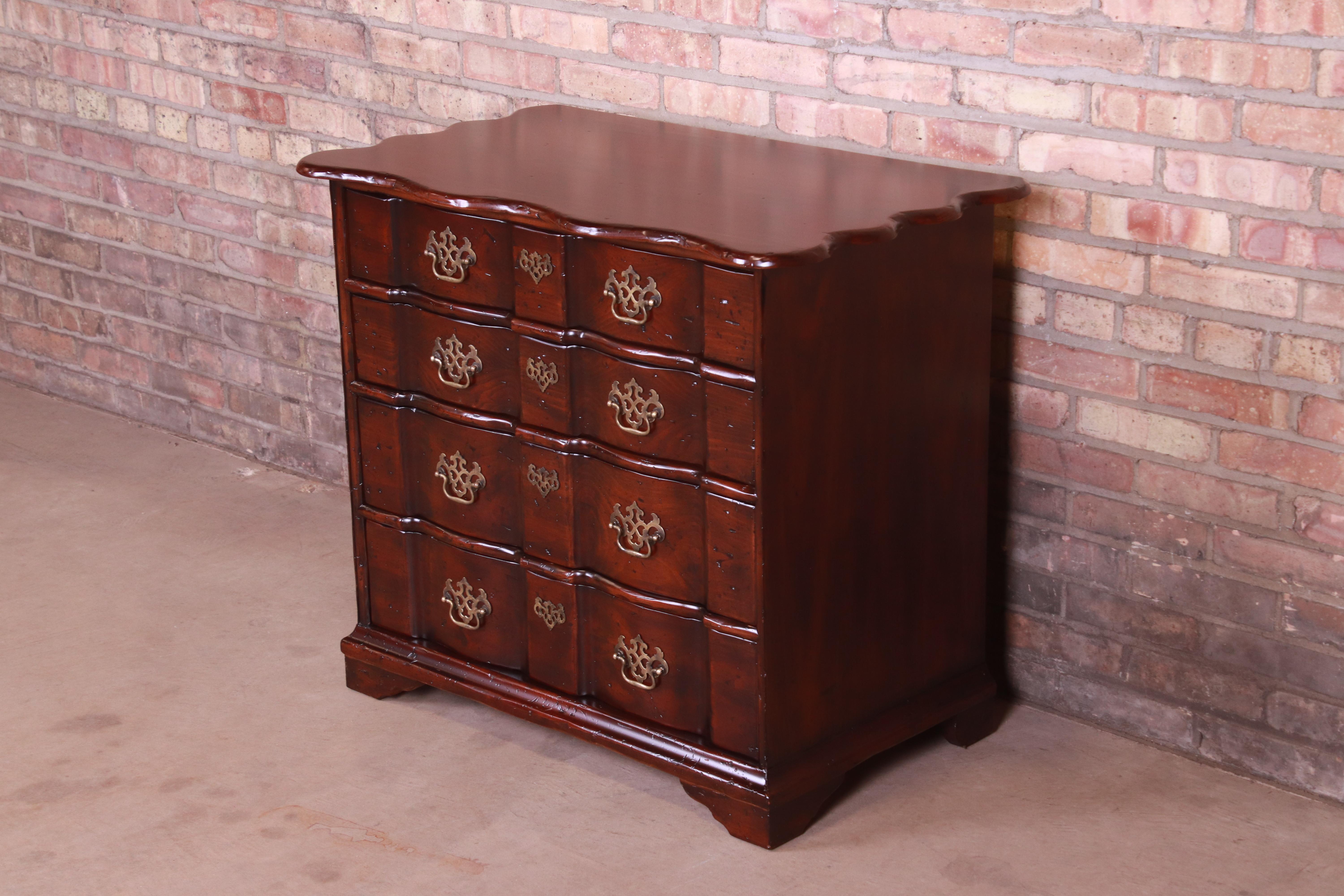 A gorgeous Chippendale style four-drawer block front dresser chest or commode

By John Widdicomb

USA, circa 1960s

Solid walnut, with original brass hardware.

Measures: 35.5