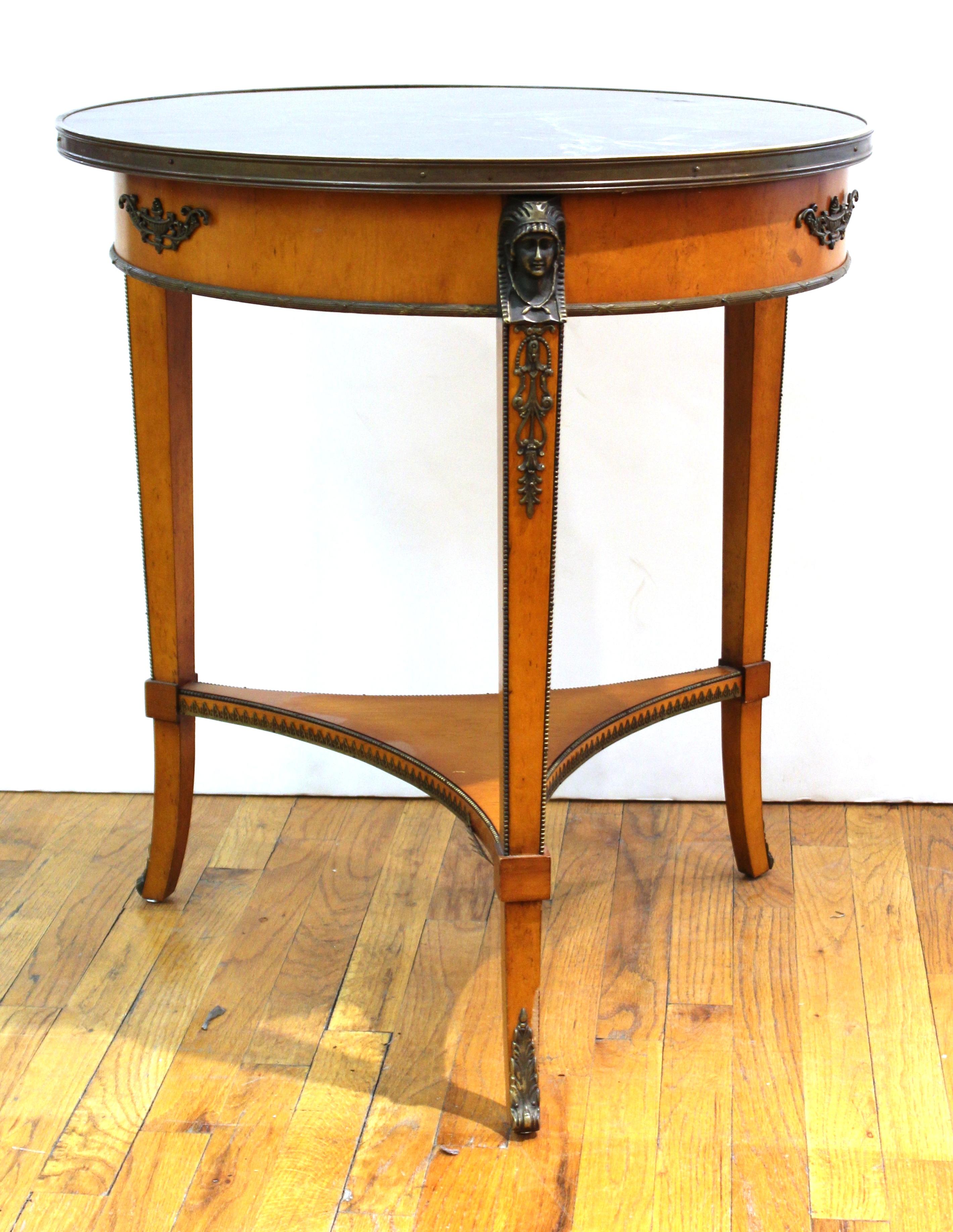 Empire style wood and marble gueridon table by John Widdicomb. The piece was made in the 20th century and comes with a green marble top. Makers mark on the bottom. In great vintage condition with age-appropriate wear and use.