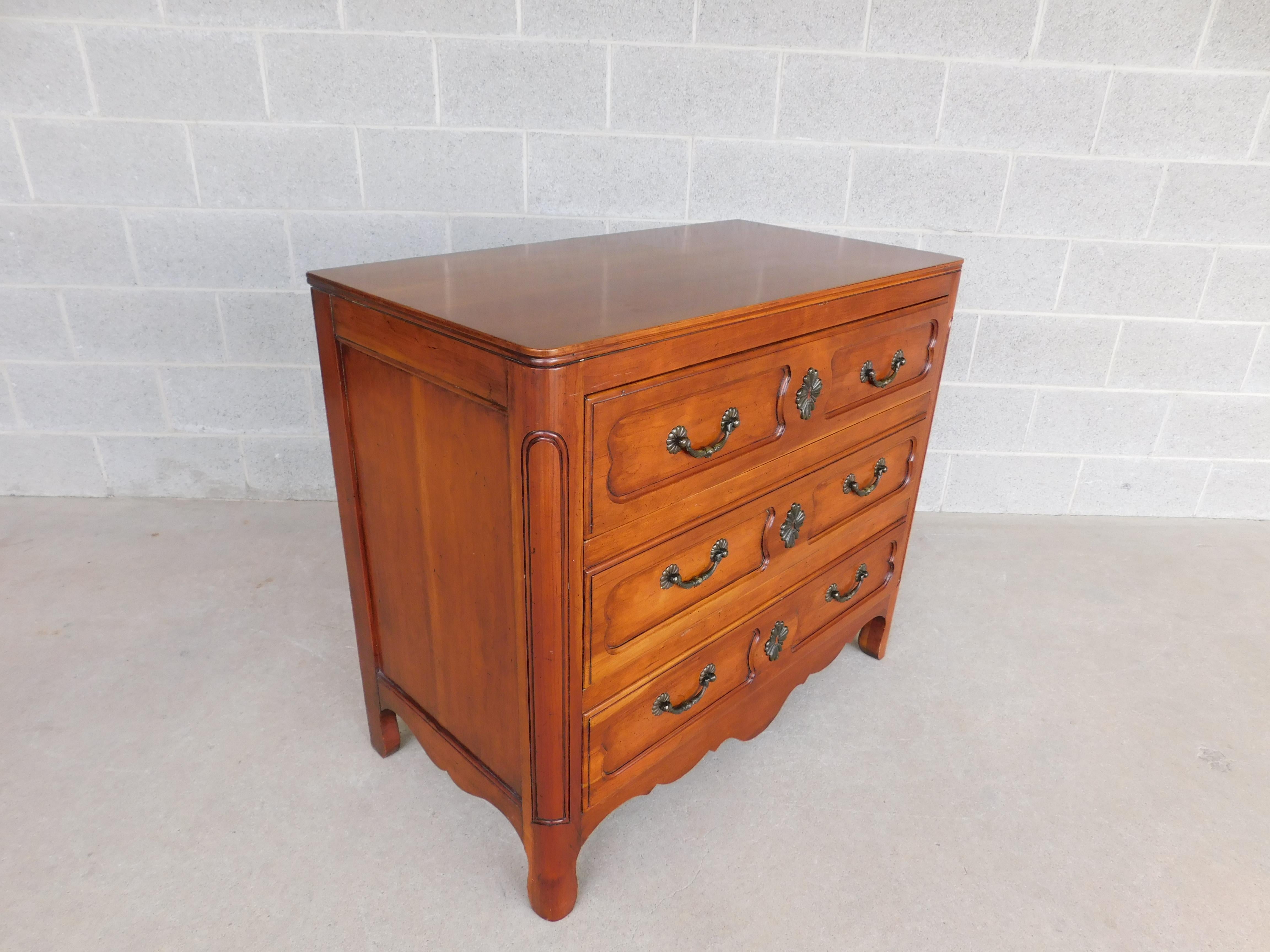 John Widdicomb French country style 3 drawer commode. Fruitwood Constructed, French Country Understated Style, 3 Recessed Panel Style Dovetailed Drawers, Quality Hardware / Pulls Faux Key Lock Hole Plate. Rounded Front Post. 
Very Good Original