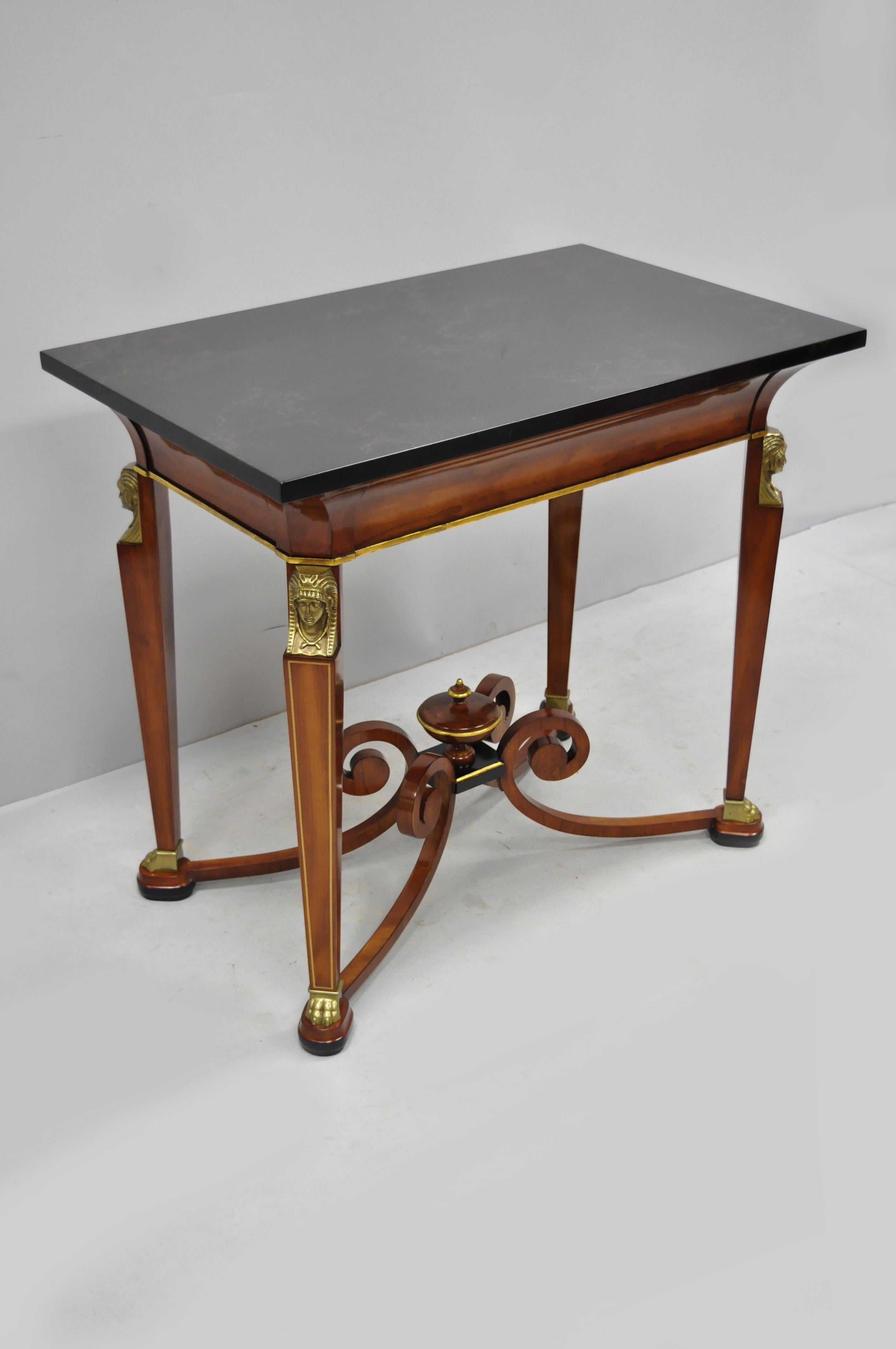 John Widdicomb French Empire figural bronze mounted occasional lamp table. Item features lacquered faux marble top, female busts and paw feet, carved wood central urn, scrolling stretcher base, original label, quality American craftsmanship, great