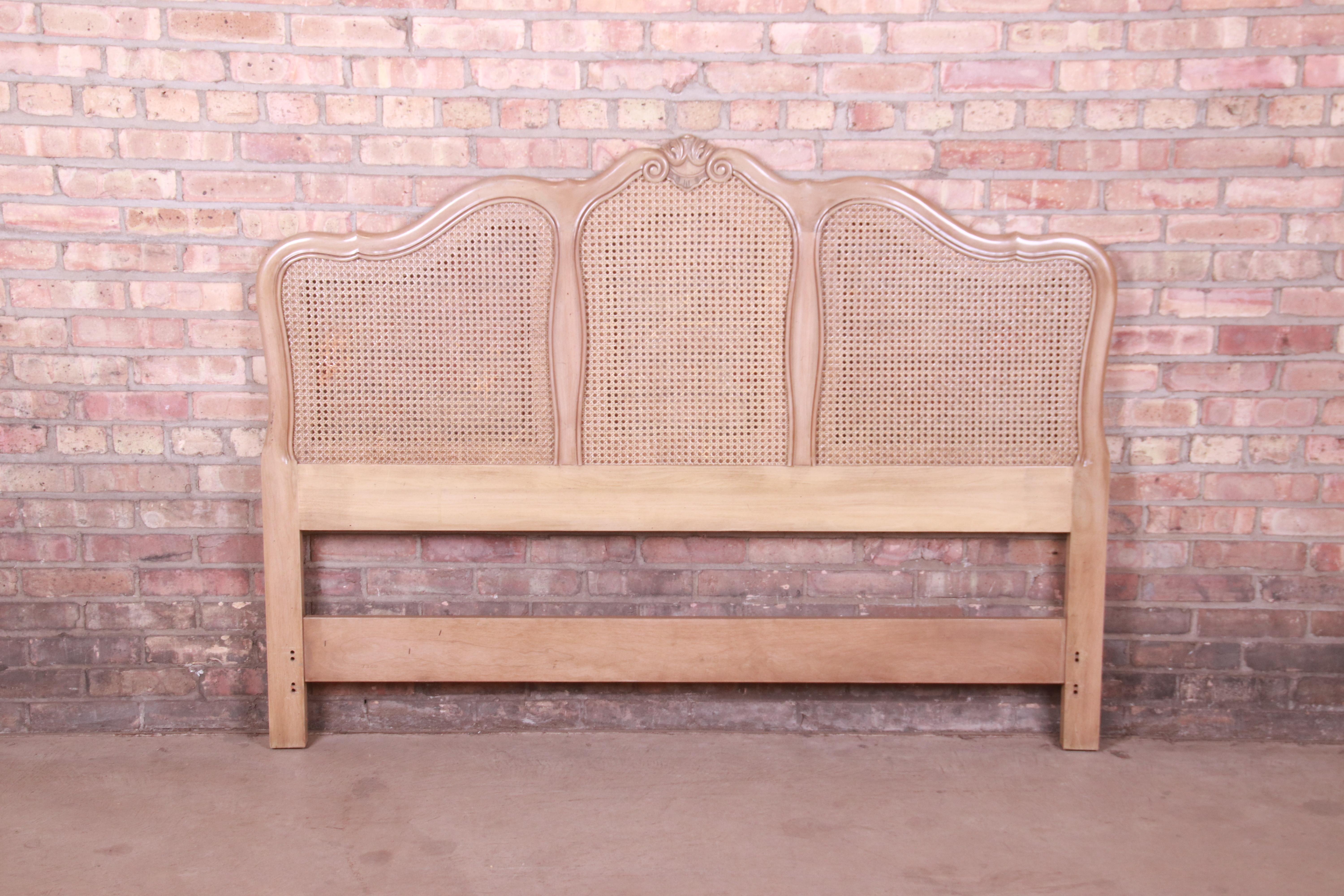 A gorgeous French Provincial Louis XV style queen size headboard

By John Widdicomb

USA, Circa 1970s

Bleached walnut, with caned panels.

Measures: 62.75