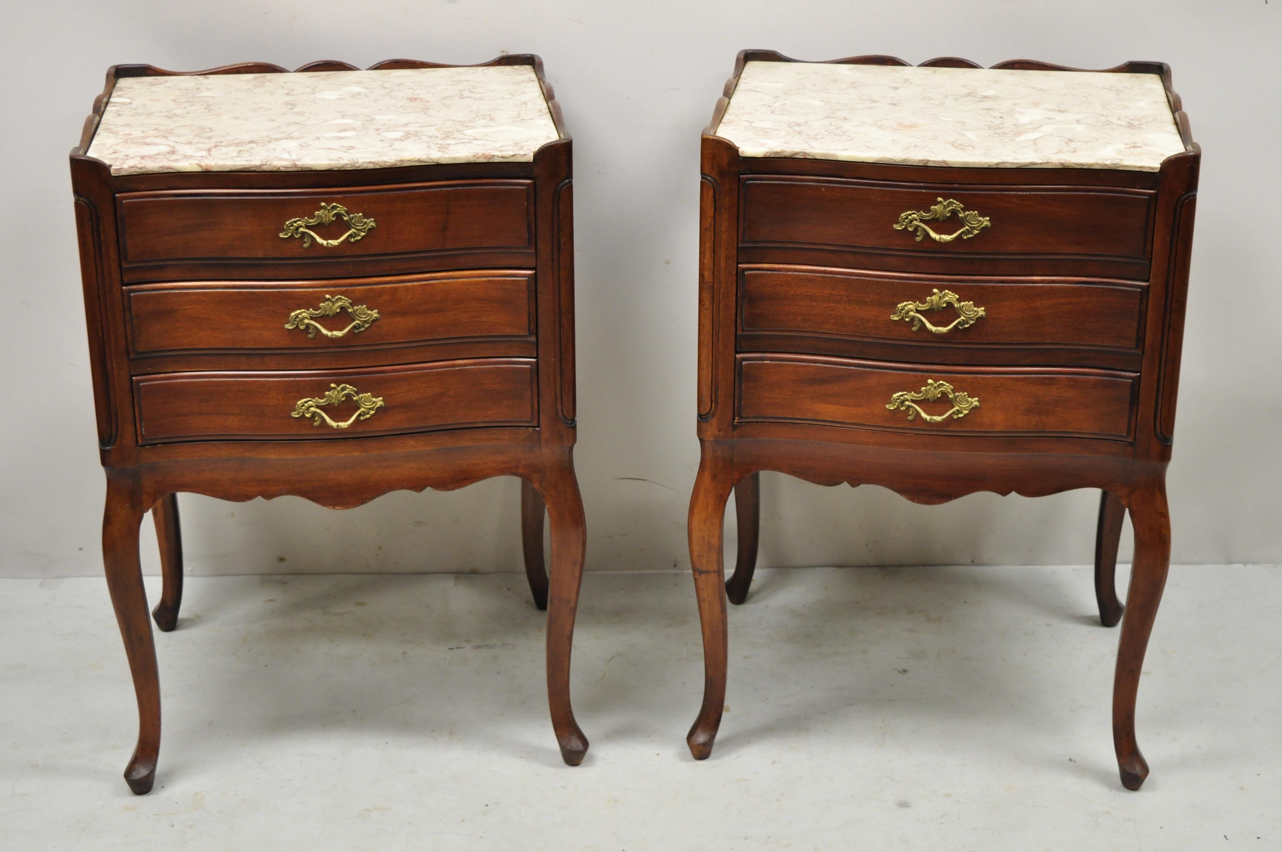 Vintage John Widdicomb French Country Provincial cherry wood pink marble top nightstands - a pair. Item features pink marble top, solid wood construction, beautiful wood grain, nicely carved details, finished back, original stamp, 3 dovetailed