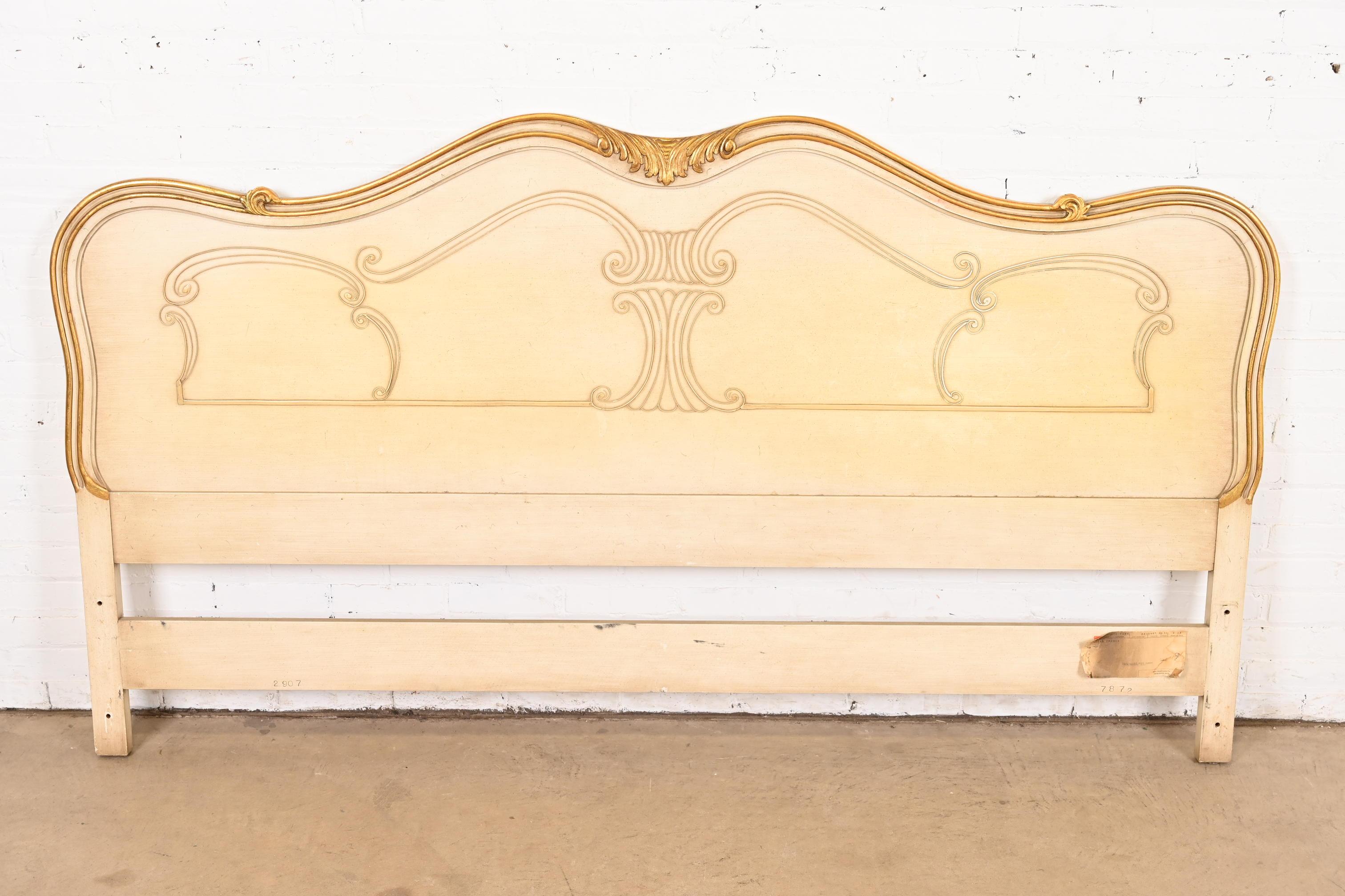 A gorgeous French Rococo or French Provincial Louis XV style king size headboard

By John Widdicomb

USA, Circa 1950s

Solid carved cherry wood, with original cream lacquered and gold gilt finish.

Measures: 80.75