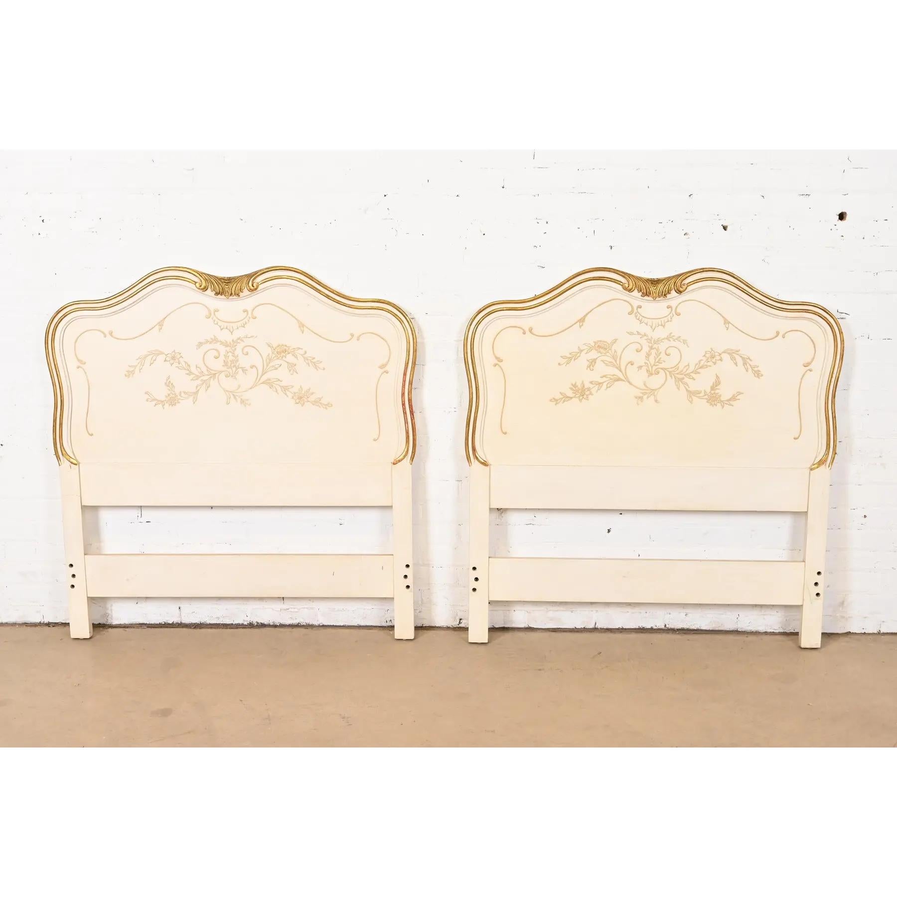 A gorgeous pair of French Rococo or French Provincial Louis XV style twin size headboards

By John Widdicomb

USA, Circa 1950s

Solid carved cherry wood, with original cream lacquered and gold gilt finish.

Each measures: 42