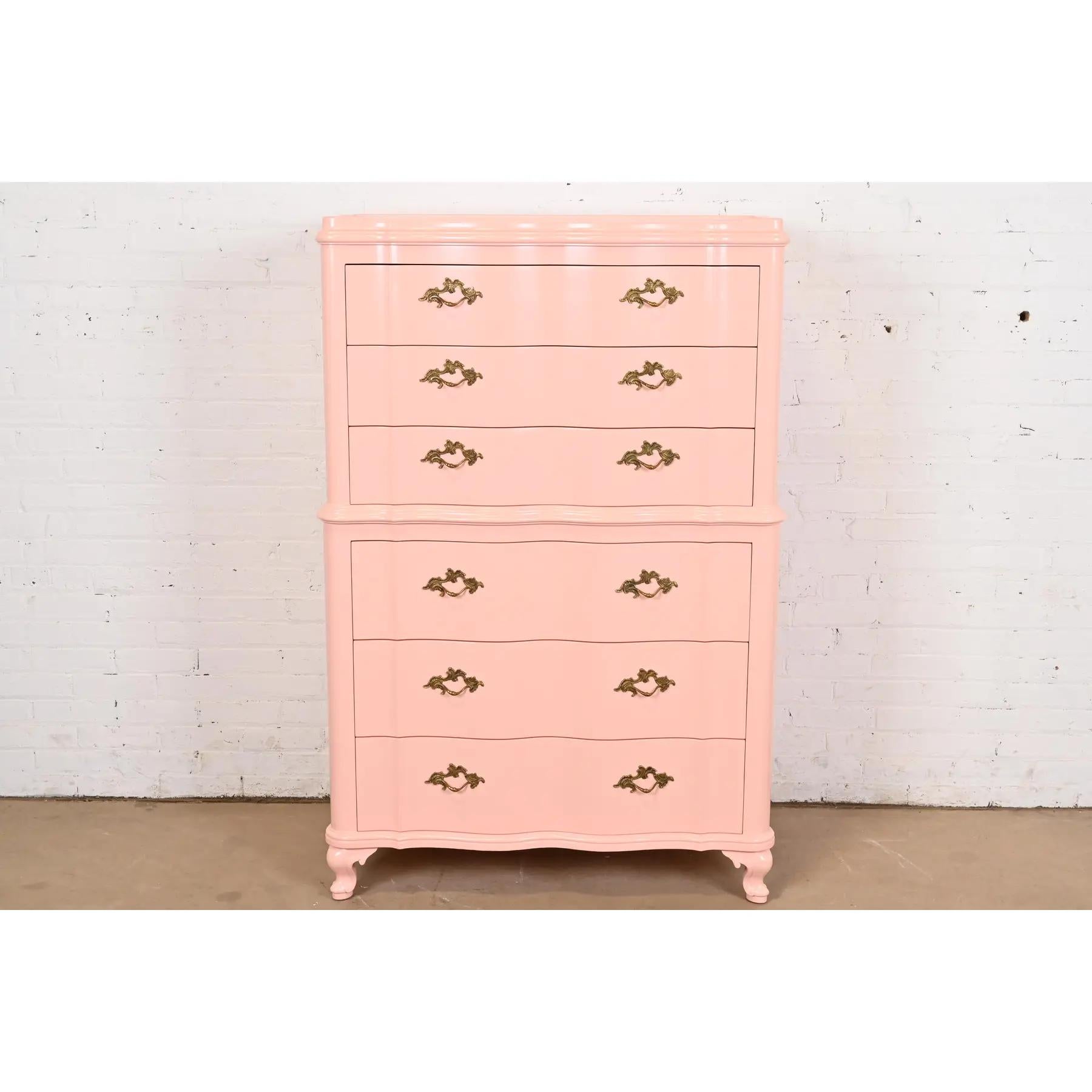 An exceptional French Provincial Louis XV style highboy dresser

By John Widdicomb

USA, Circa 1940s

Pink lacquered mahogany, with original brass hardware.

Measures: 39.25