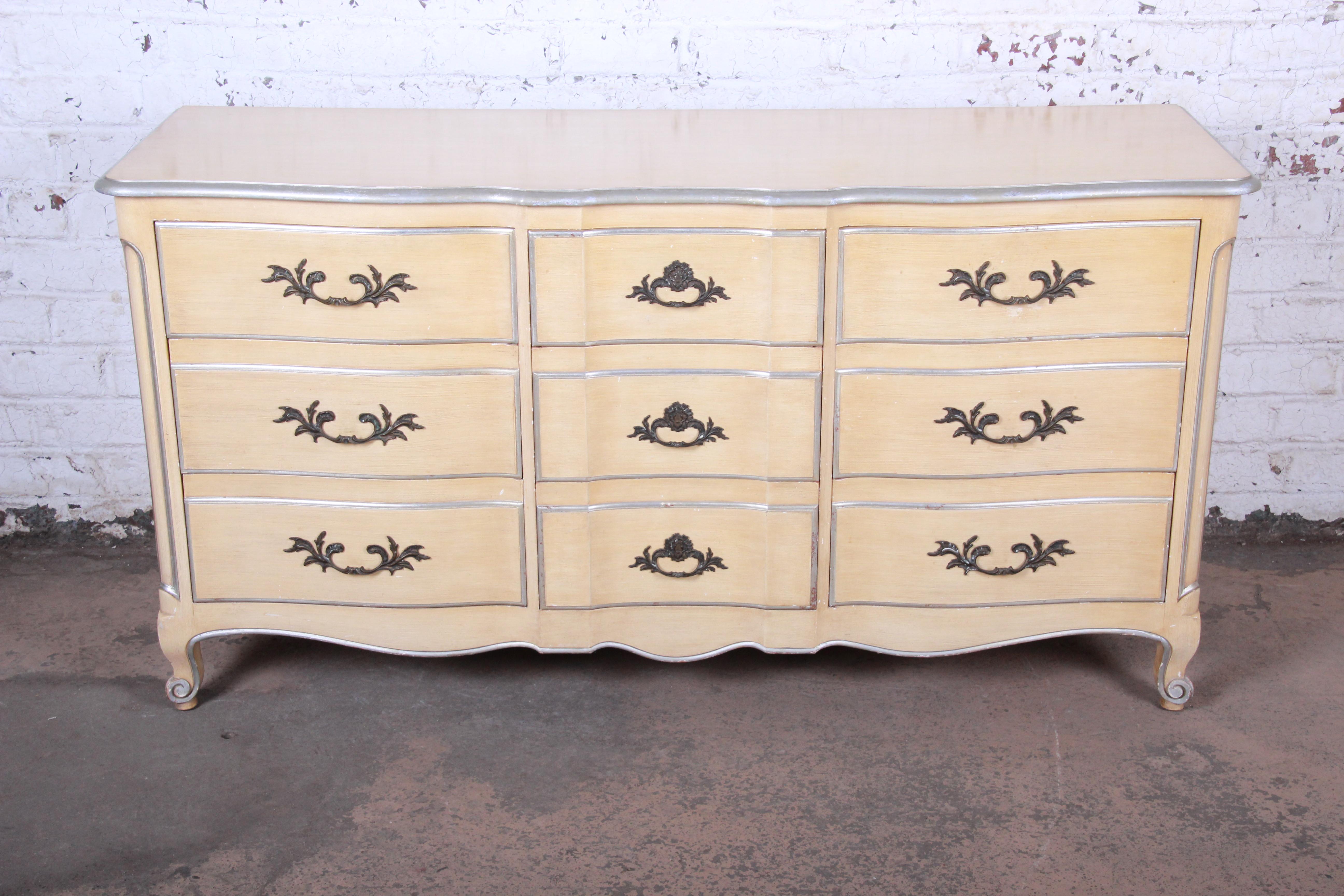 French Provincial Louis XV style triple dresser or credenza

Made by John Widdicomb

Grand Rapids, USA, circa 1950s

Solid cherry construction and original custom paint in cream and silver and brass hardware

Measures: 66