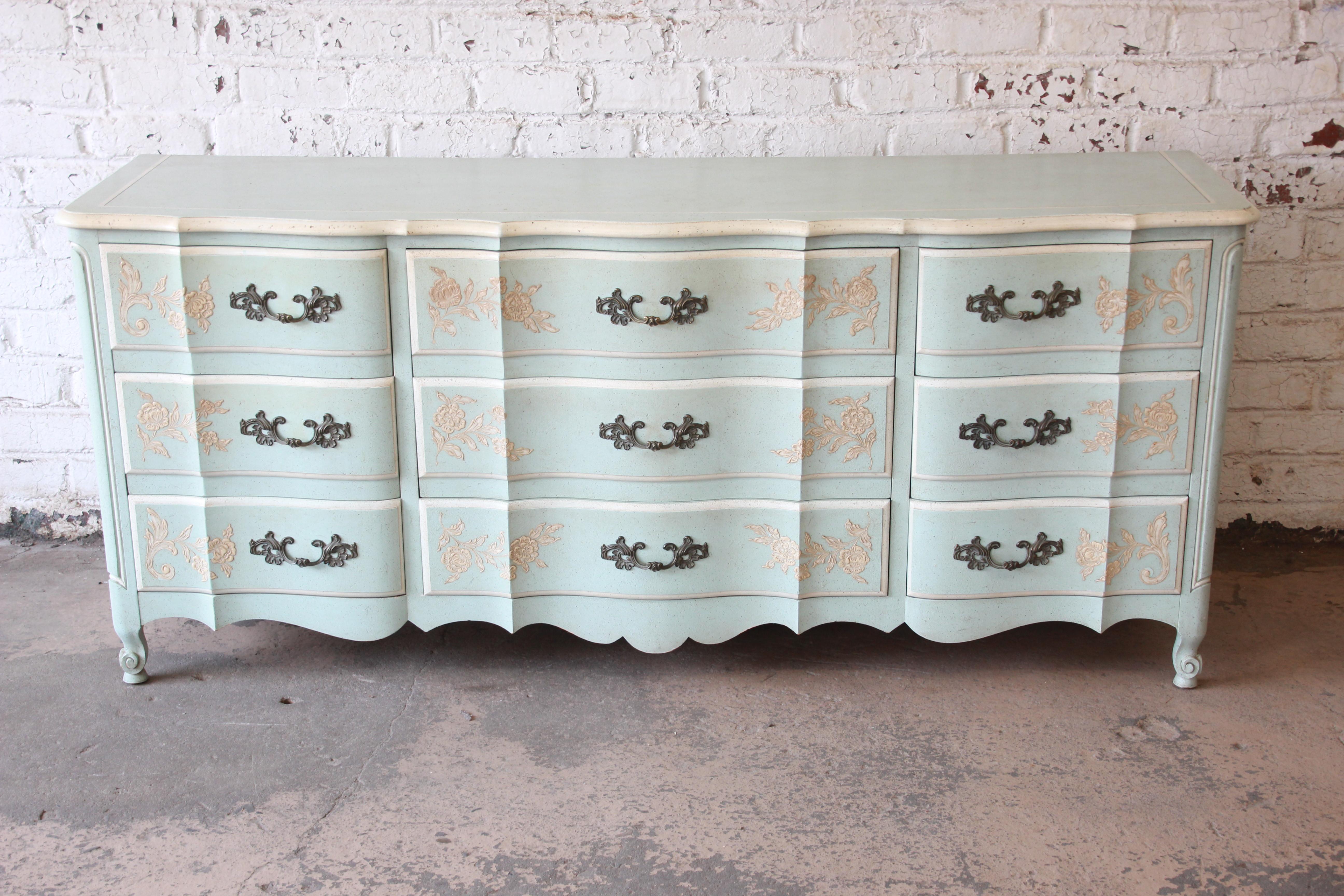 Offering a very nice French provincial Louis XV style dresser by John Widdicomb. The exceptional solid wood piece has a nice light blue shabby chic finish with nine large drawers and classic French details. The piece is in very good vintage