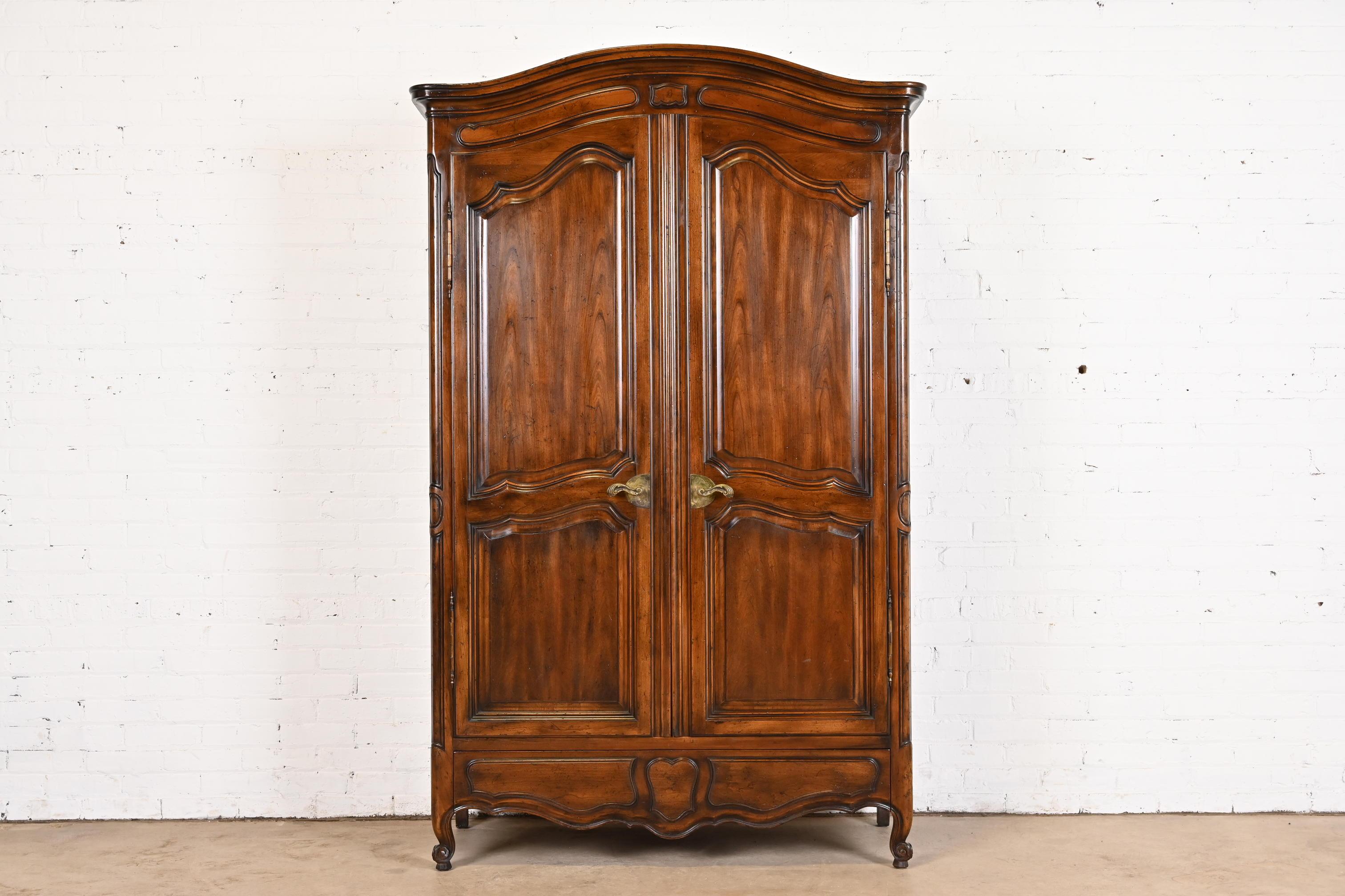 A gorgeous French Provincial Louis XV style armoire dresser or linen press

By John Widdicomb

USA, Circa 1960s

Beautiful carved solid walnut, with original brass hardware.

Measures: 49