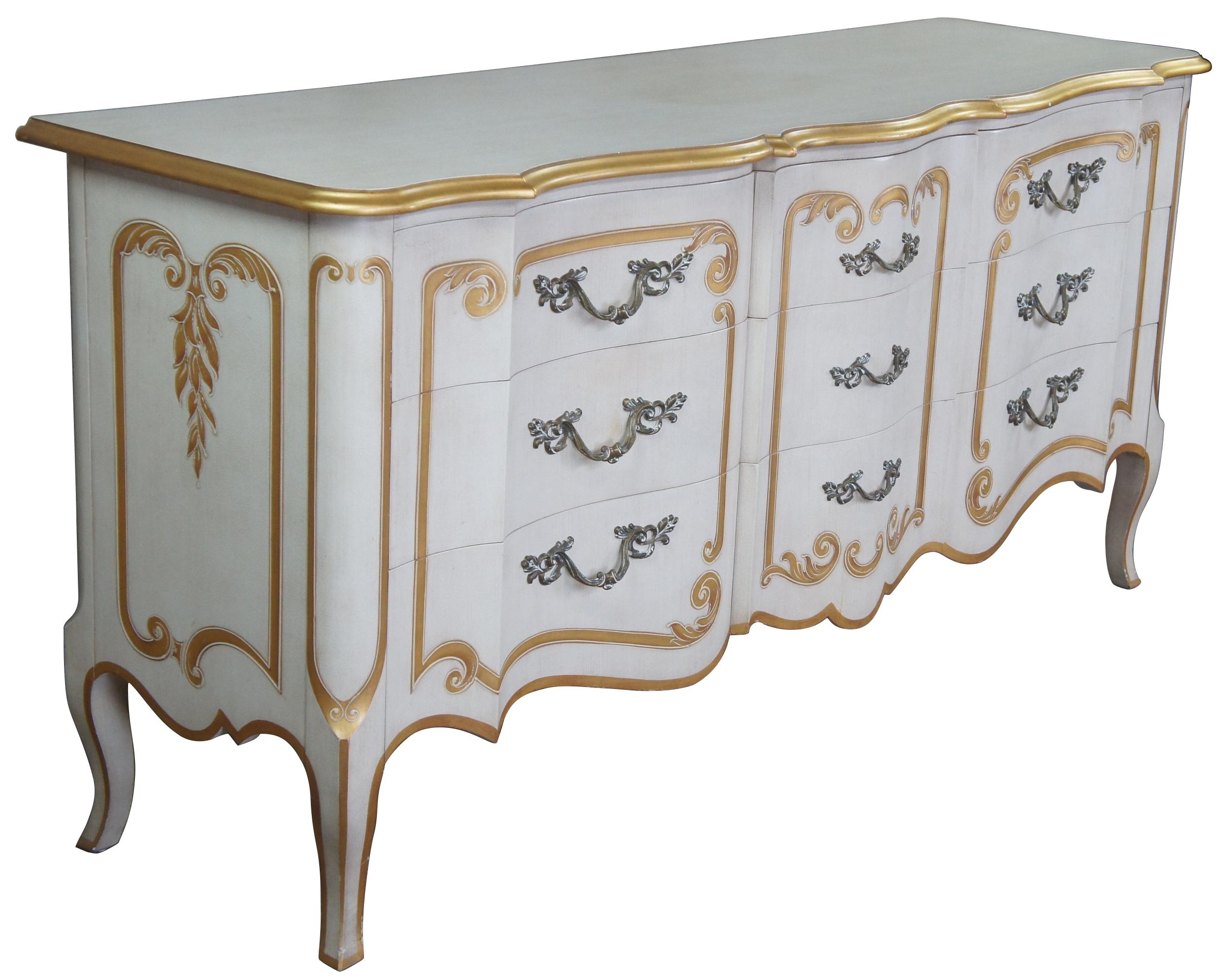 John Widdicomb dresser, circa 1960s. Drawing inspiration from Italian Florentine and Provincial. Features a rectangular form with serpentine front, 9 dovetail drawers with dividers and cabriole legs. Finished in antique white with gold painted