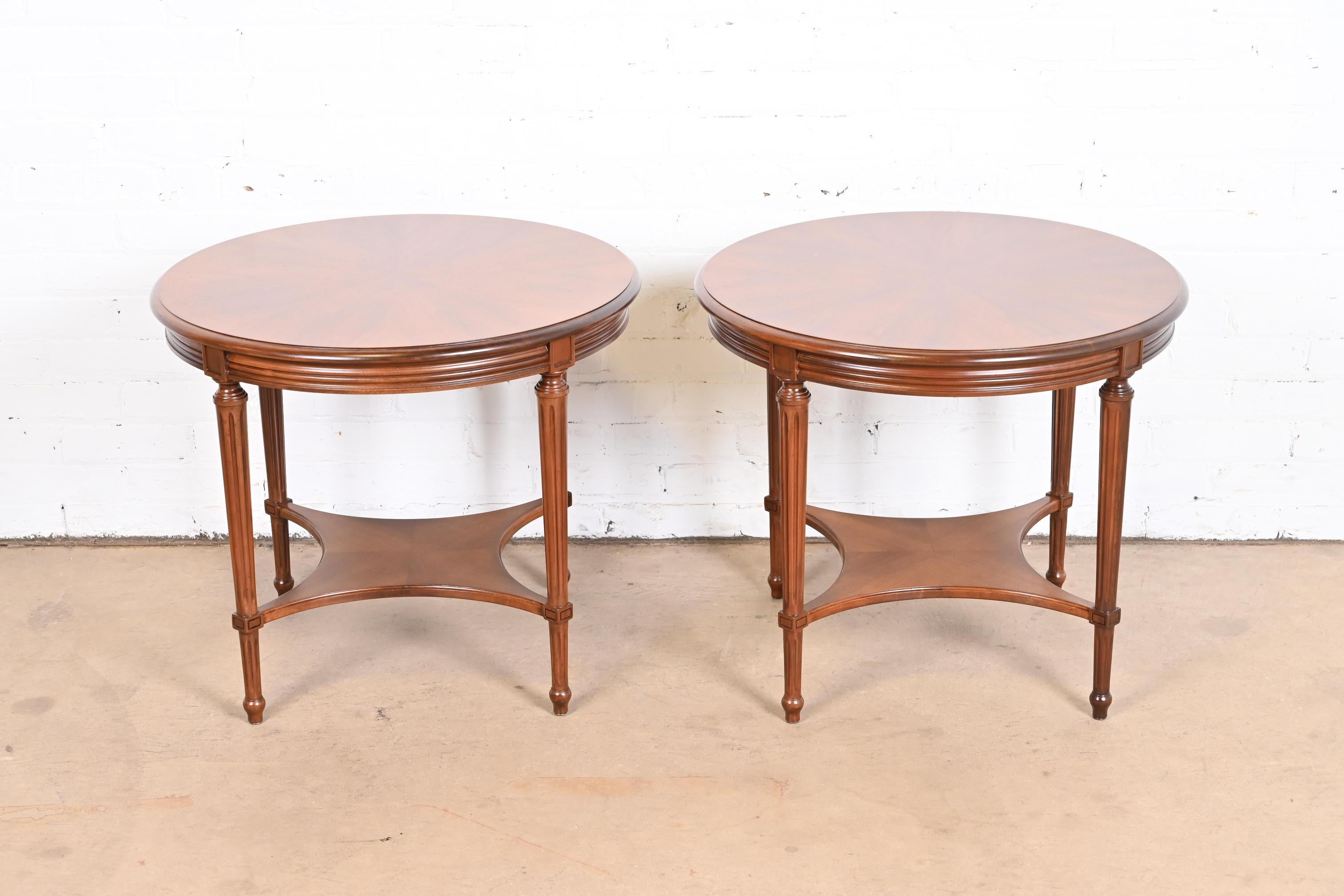 A gorgeous pair of French Regency Louis XVI style round side tables

By John Widdicomb

USA, Circa 1960s

Carved walnut, with gorgeous starburst design on top.

Measures: 26