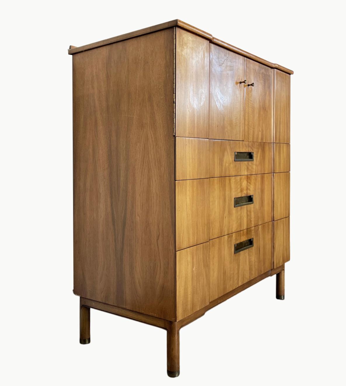 Stunningly elegant gentleman's chest made by John Widdicomb. John Widdicomb was a manufacturing company with a long tradition of crafting some of the biggest names in furniture like T.H. Robsjohn-Gibbings. The company was purchased in 2002 by