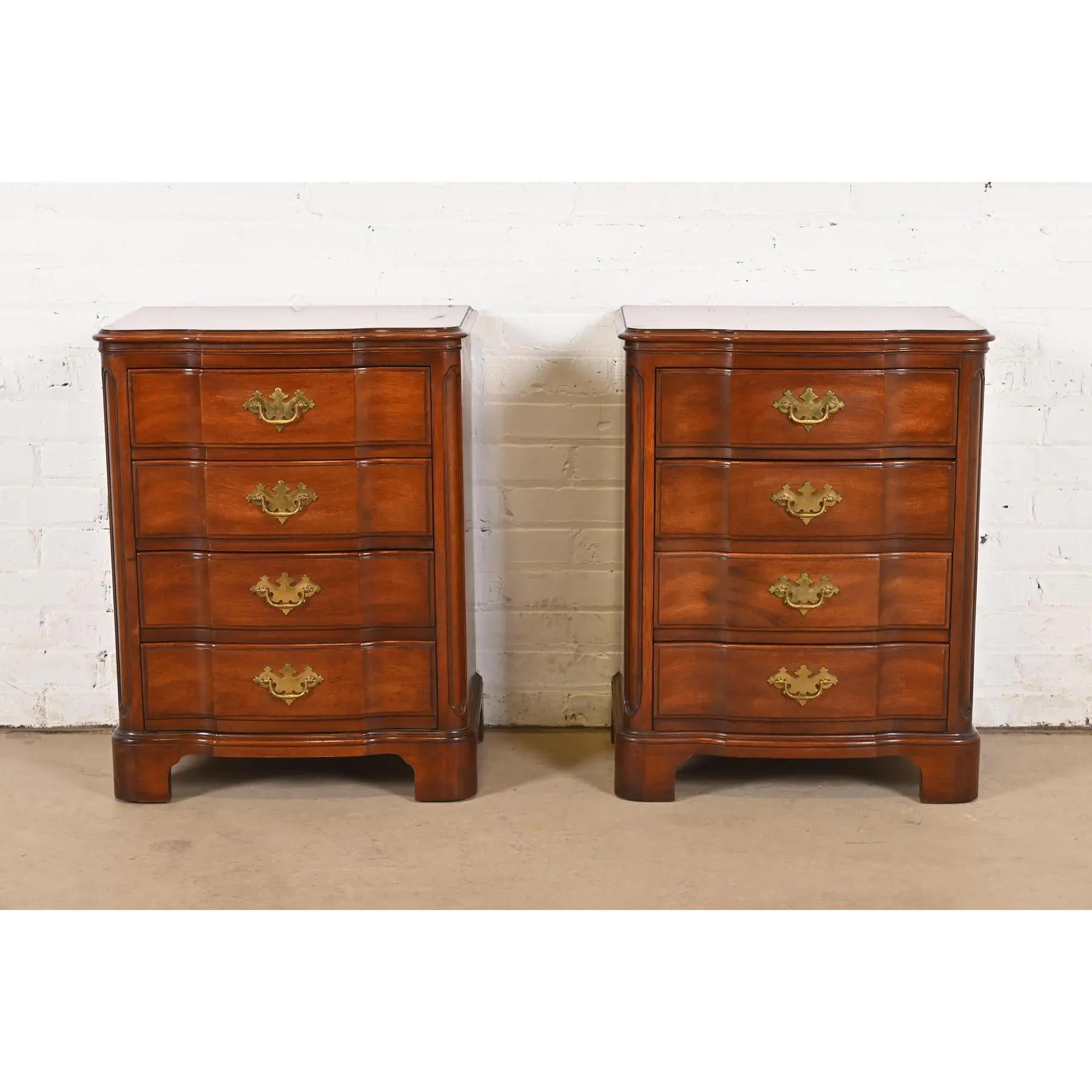 A gorgeous pair of Georgian or Chippendale style four-drawer nightstands or chests of drawers

Designed by Ralph Widdicomb for John Widdicomb

USA, Circa 1940s

Solid carved mahogany, with original brass hardware.

Each measures: 21