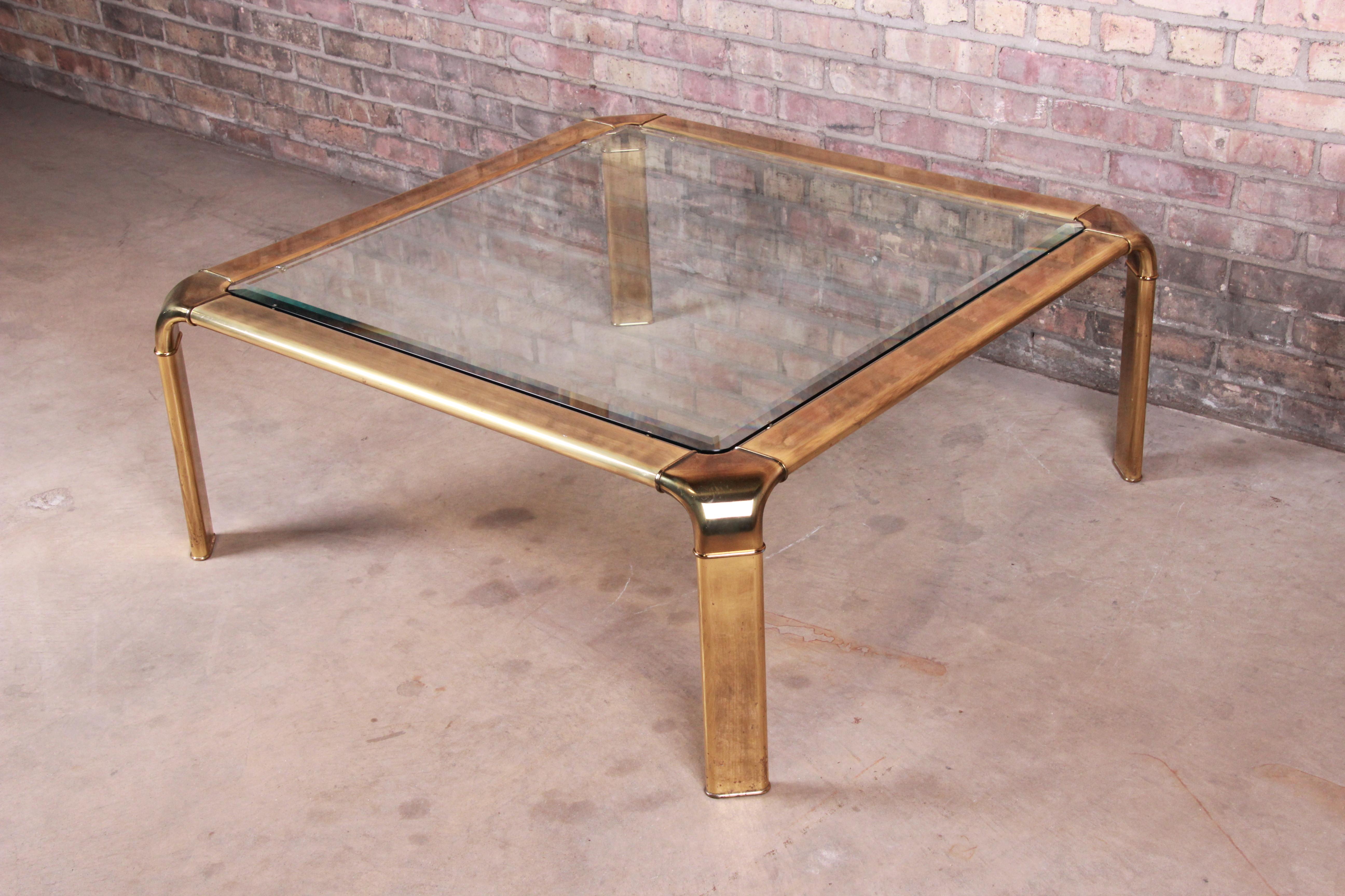 An exceptional Mid-Century Modern Hollywood Regency coffee or cocktail table

By John Widdicomb

USA, circa 1970s

Brass frame with beveled glass top.

Measures: 40