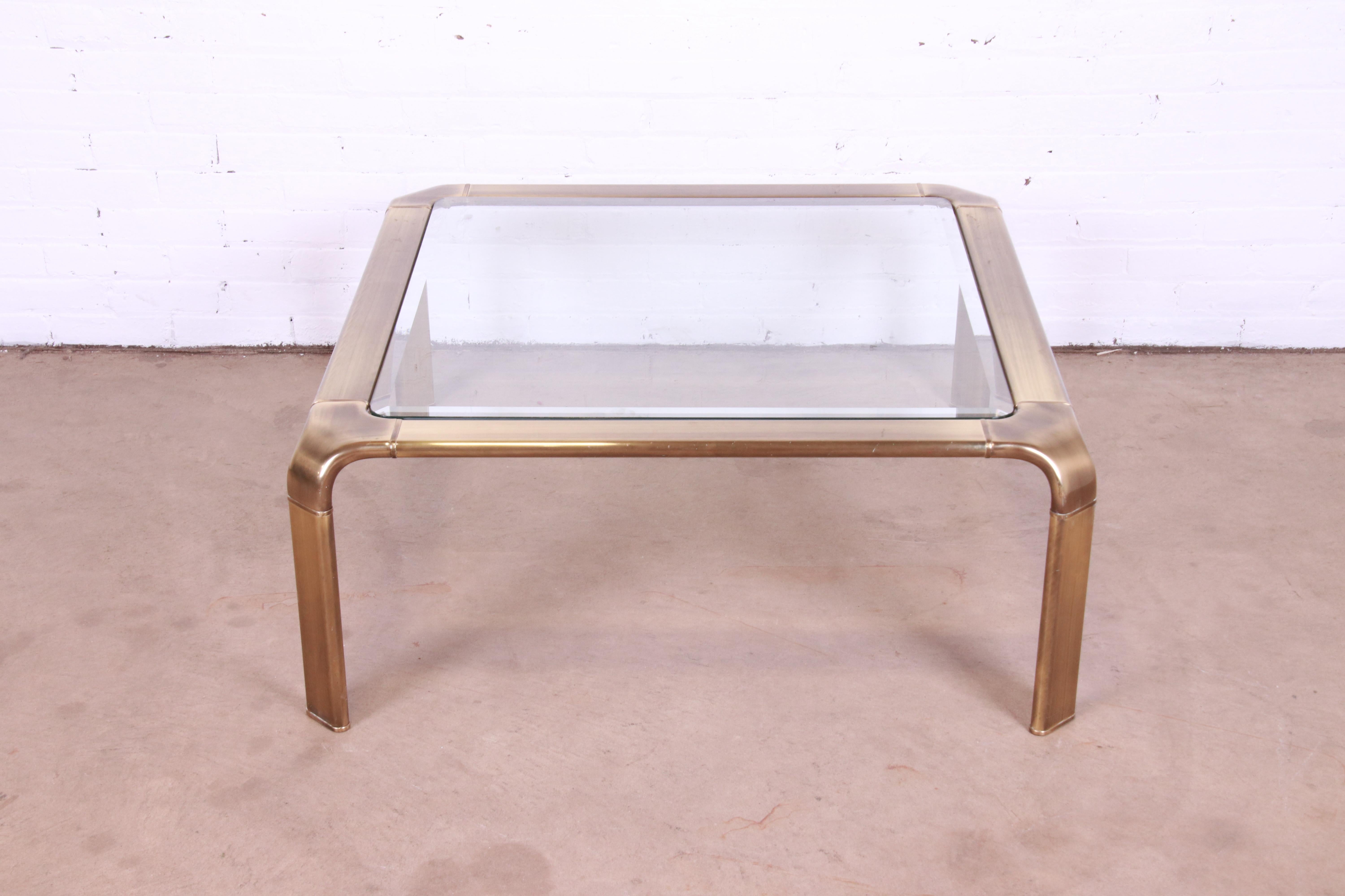 An exceptional Mid-Century Modern Hollywood Regency coffee or cocktail table

By John Widdicomb

USA, Circa 1970s

Brass frame with beveled glass top.

Measures: 39
