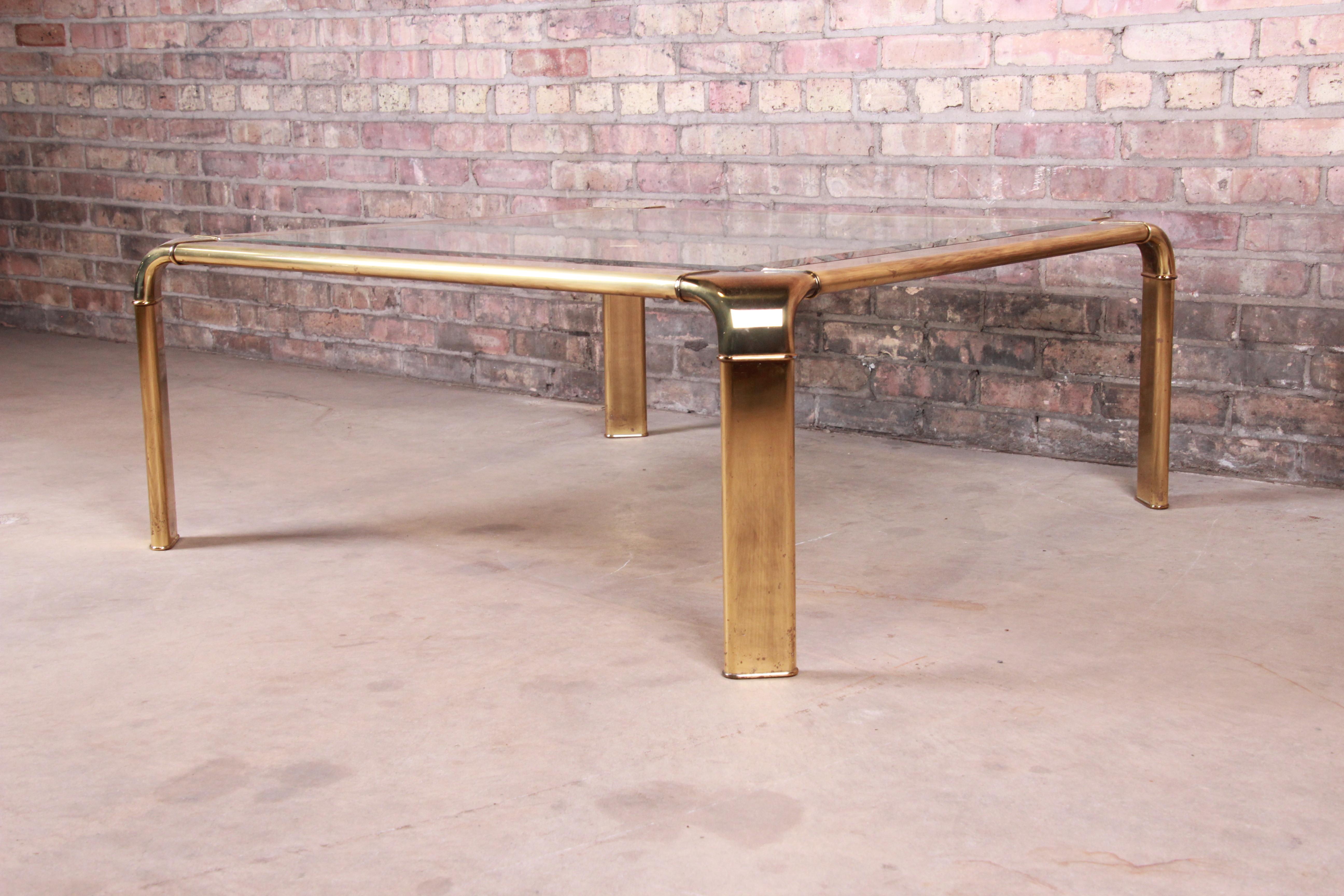 Beveled John Widdicomb Hollywood Regency Brass and Glass Cocktail Table, circa 1970s