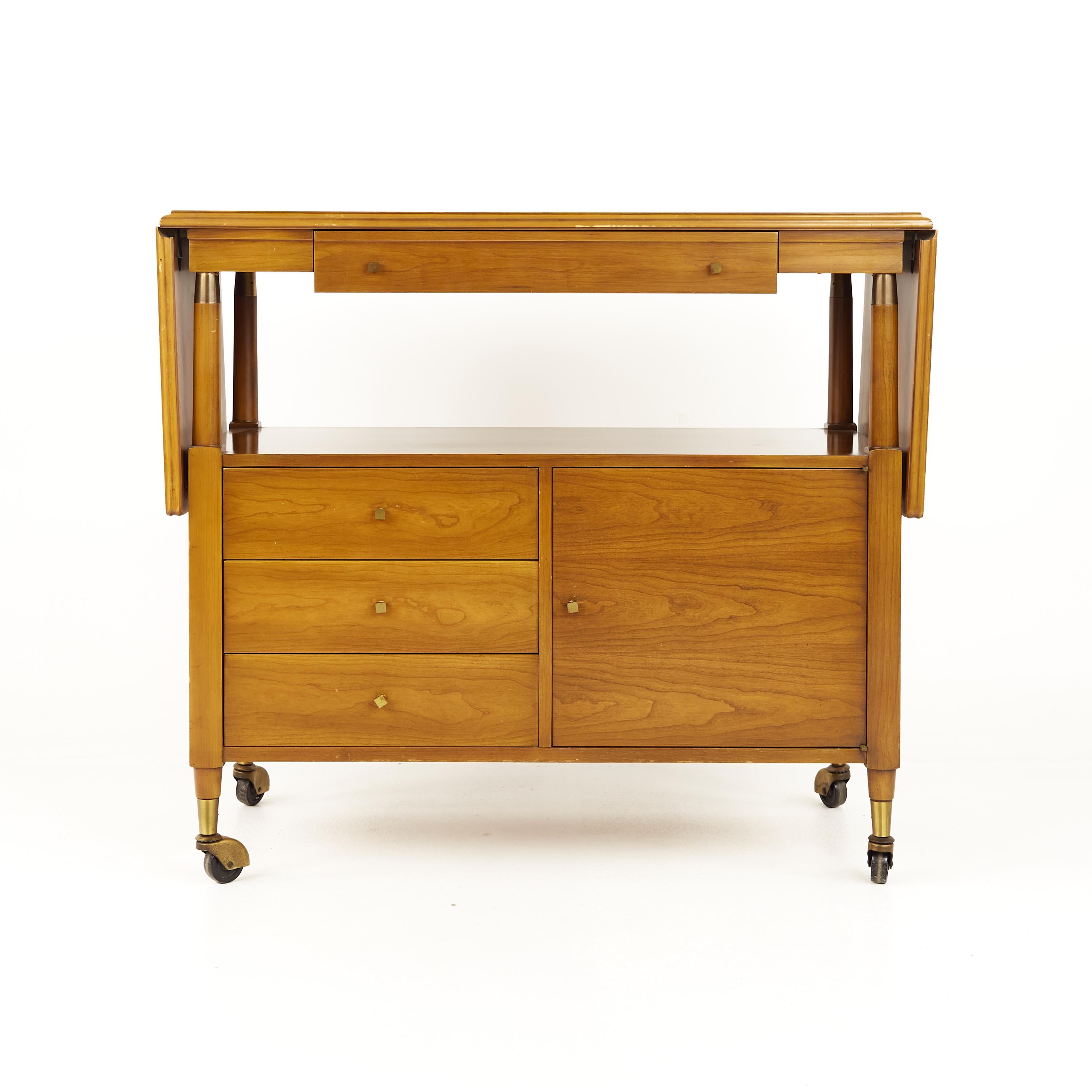 John Widdicomb mid century bar cart

This cart measures 38 wide x 18 deep x 33 inches high, and when open 64.5 inches wide

All pieces of furniture can be had in what we call restored vintage condition. That means the piece is restored upon