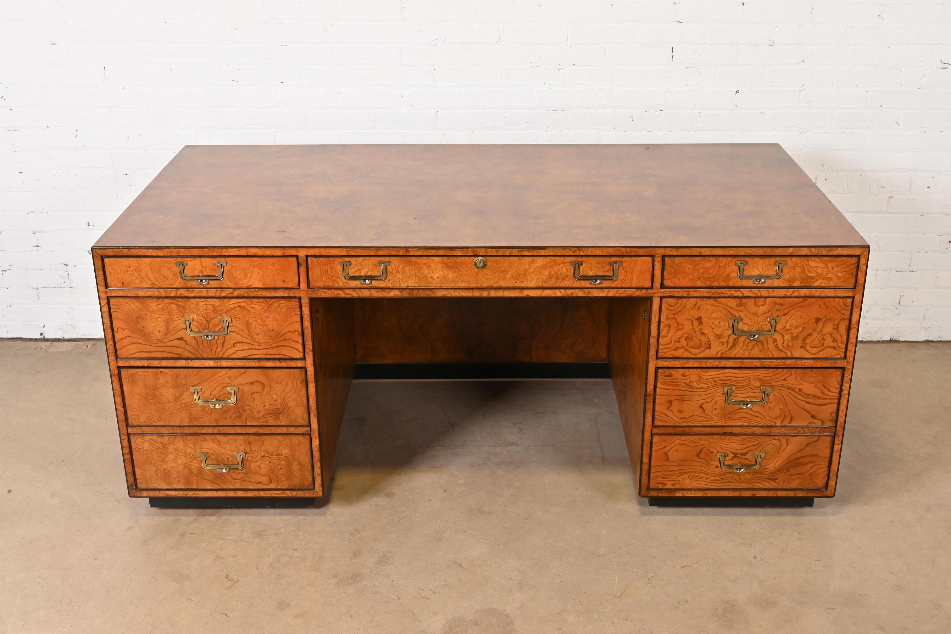An exceptional Mid-Century Modern Hollywood Regency Campaign executive desk

By John Widdicomb

USA, Circa 1970s

Gorgeous burl wood, with original brass hardware.

Measures: 72