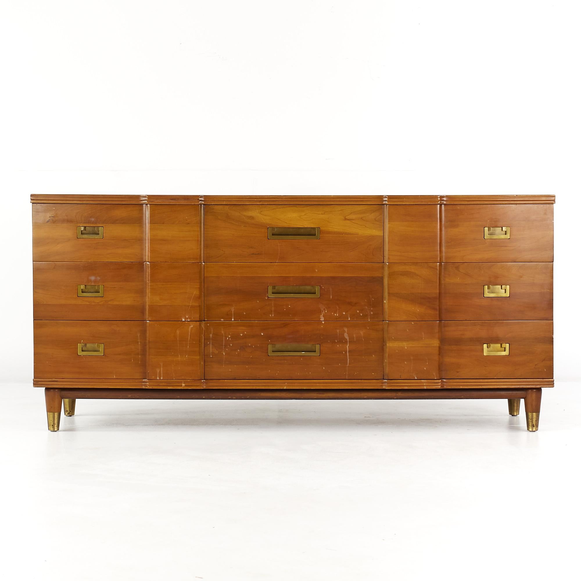 John Widdicomb Mid Century walnut and brass 9 drawer lowboy dresser

This dresser measures: 70.25 wide x 21 deep x 32 inches high

All pieces of furniture can be had in what we call restored vintage condition. That means the piece is restored