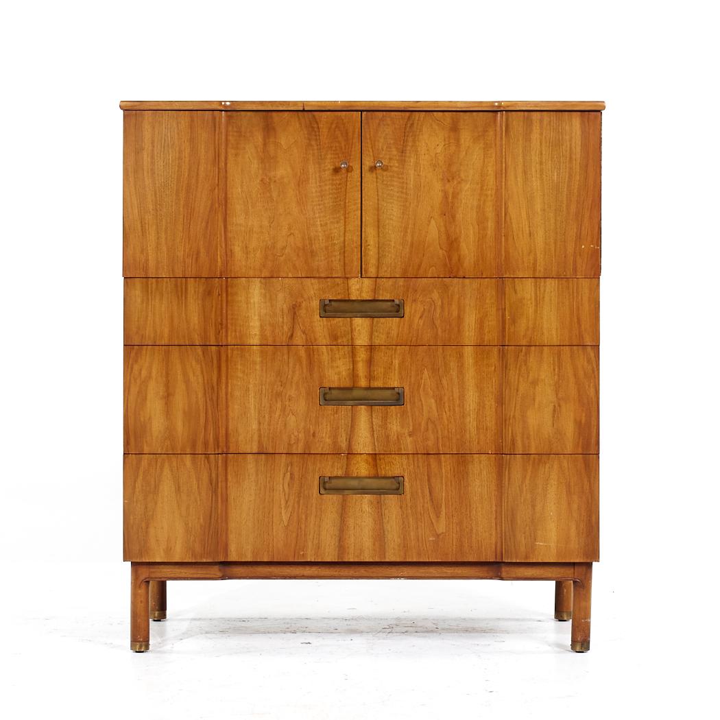 John Widdicomb Mid Century Walnut and Brass Highboy Dresser

This highboy measures: 40.5 wide x 20 deep x 47 inches high

All pieces of furniture can be had in what we call restored vintage condition. That means the piece is restored upon purchase