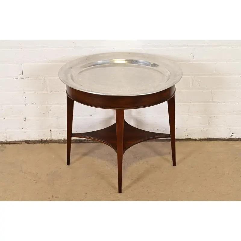 A gorgeous modern Regency style drinks table, tea table, or occasional side table with removable serving tray top

By John Widdicomb

USA, Circa Late 20th Century

Gorgeous mahogany, with pewter tray top.

Measures: 19