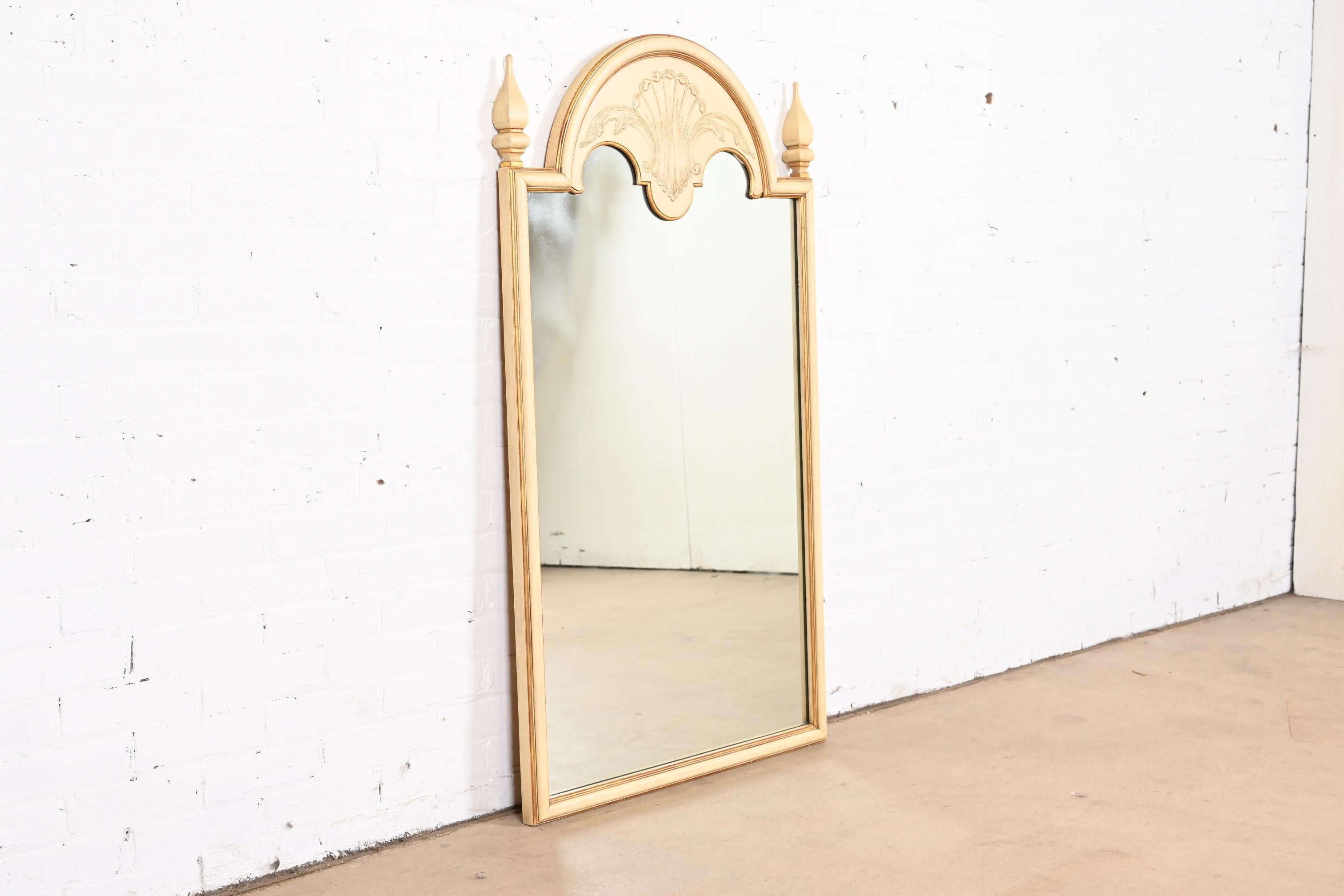 A gorgeous Neoclassical or Louis XVI style wall mirror

By John Widdicomb

USA, Circa 1950s

Carved cherry wood frame, with original cream painted and gold gilt finish.

Measures: 29