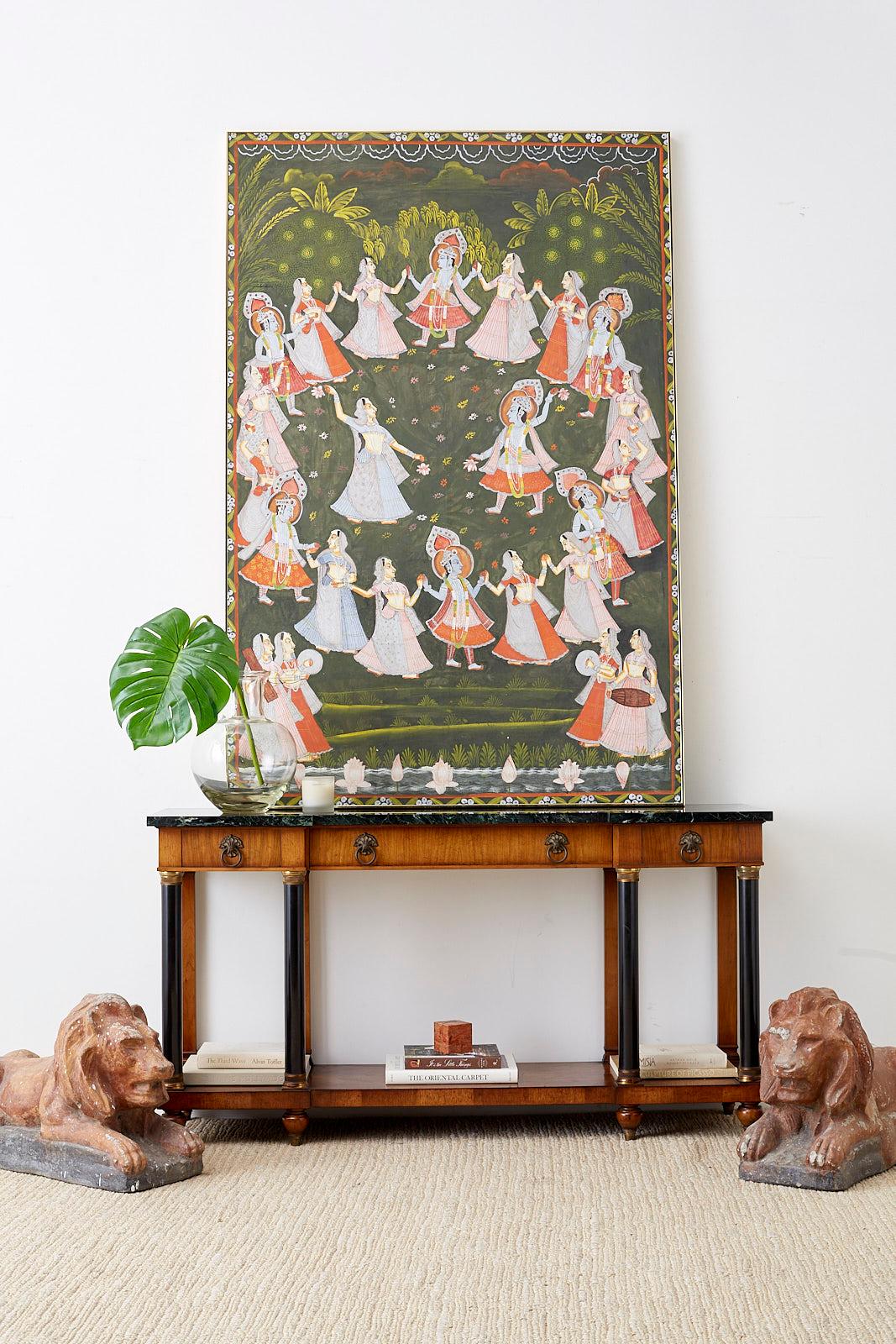 Impressive French neoclassical style console table or sideboard made by William Berkey Furniture for John Widdicomb. Features a large slab of dark green Italian marble for the top that conforms to the columned base. The case is fronted by three