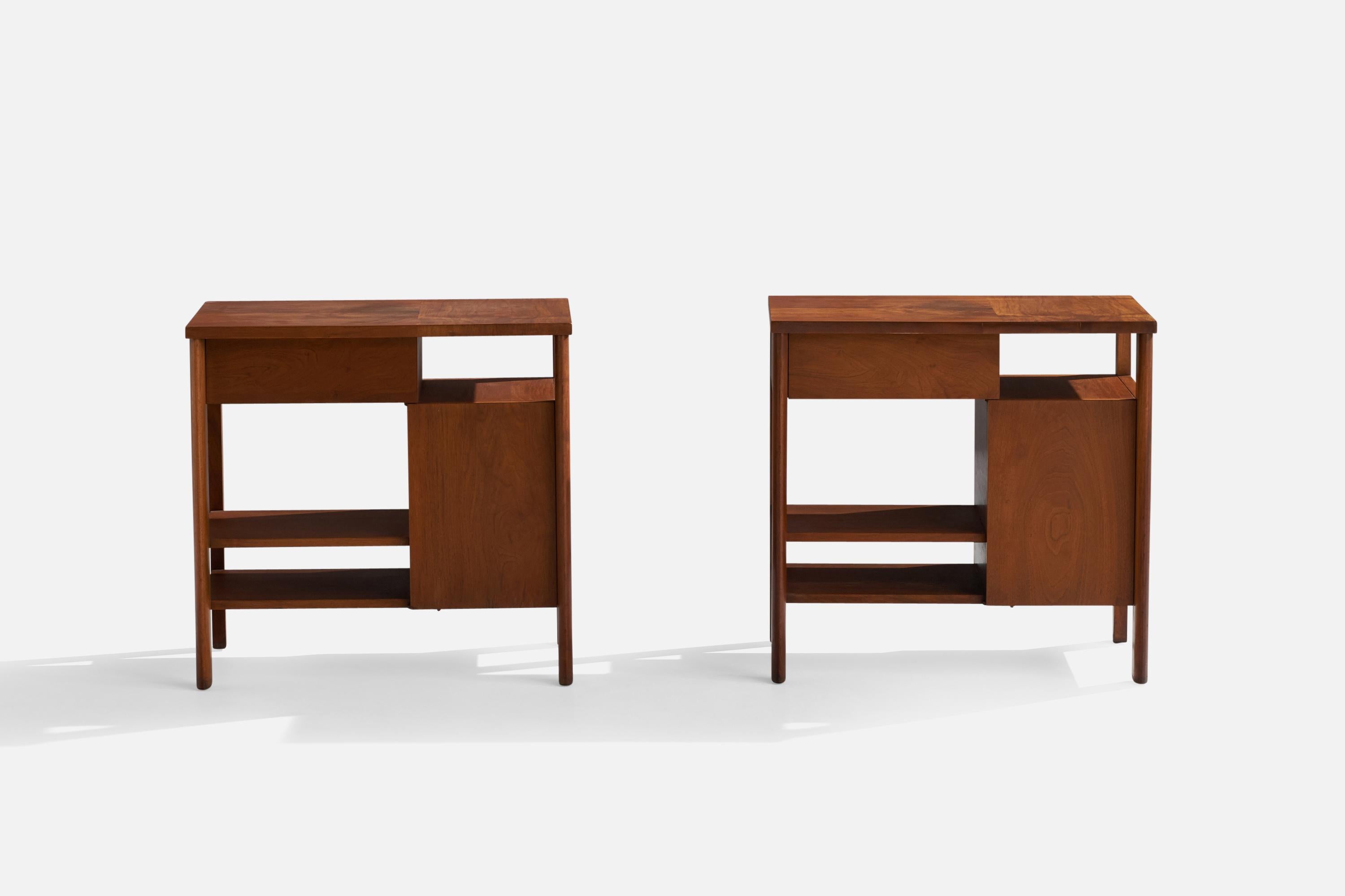 A pair of walnut nightstands or bedside cabinets designed and produced by John Widdicomb, Grand Rapids, Michigan, USA, 1950s.