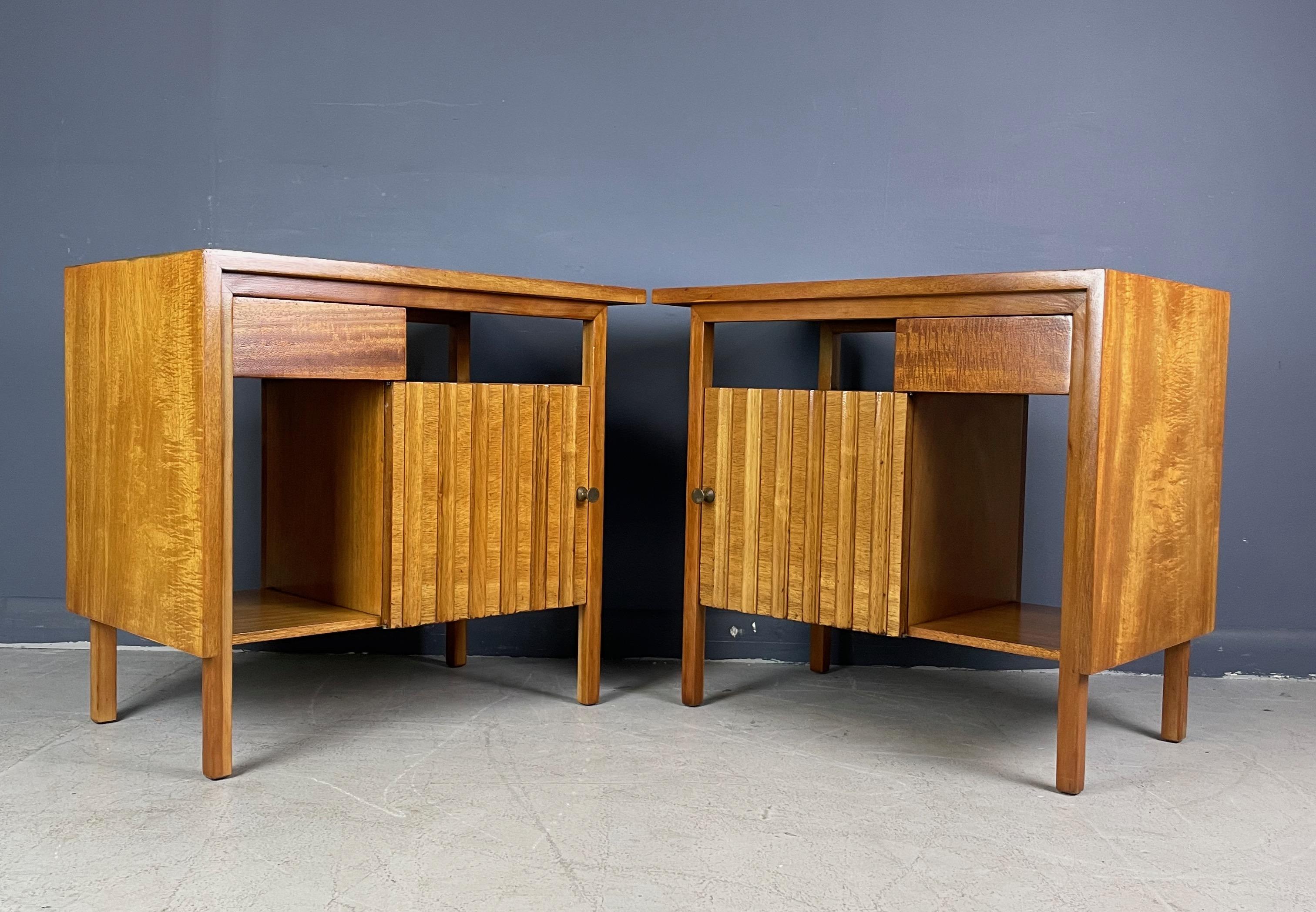 Beautifully refinished, these night stands with their undulating door detail and asymmetric drawer will grace any bedroom especially if your decorating a smaller apartment or bedroom the small silhouette will be greatly appreciated.
