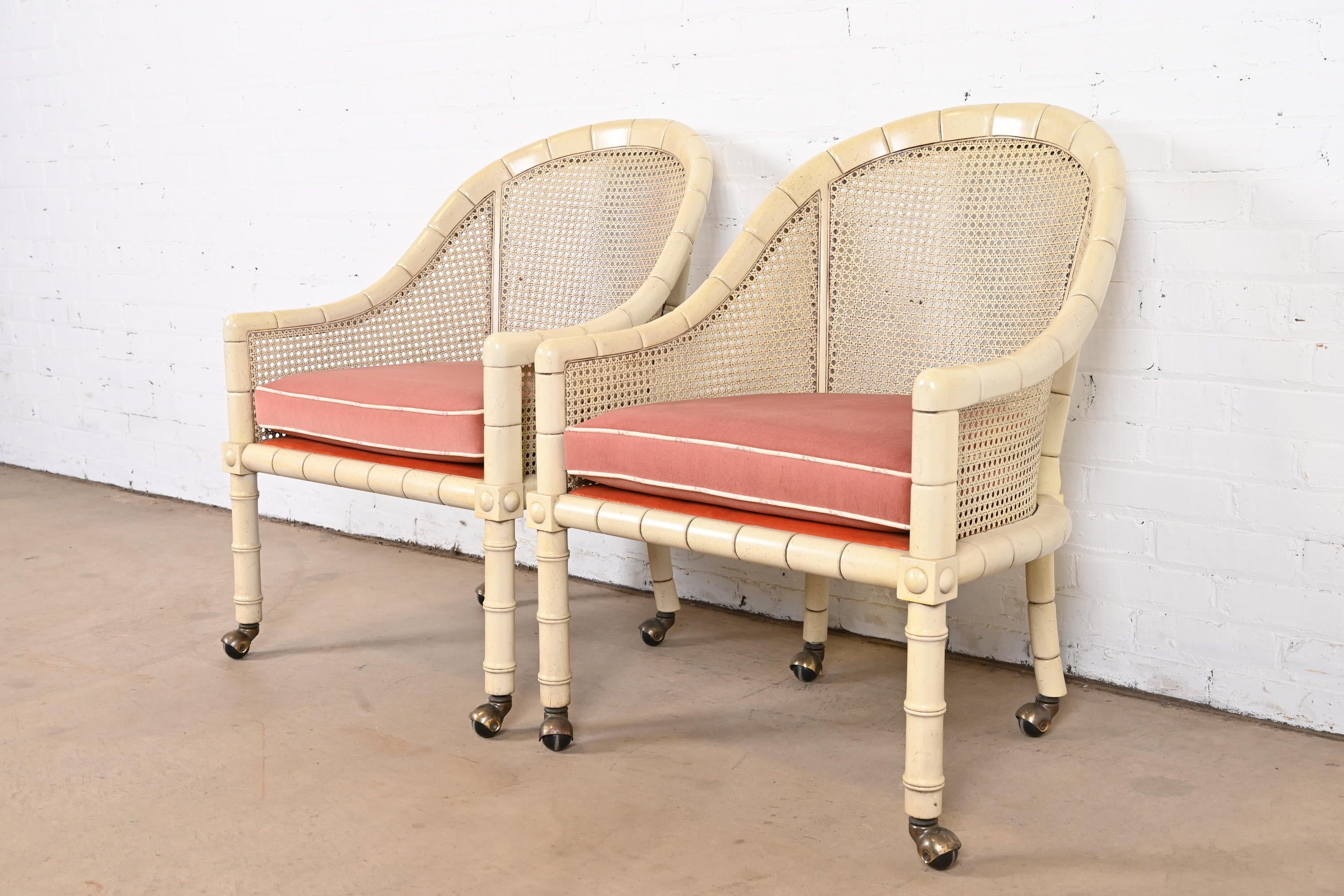 A gorgeous pair of Mid-Century Modern Regency style faux bamboo club chairs on casters

By John Widdicomb

USA, Circa 1950s

Ivory lacquered walnut bamboo form frames, on casters, with caned sides and seat backs and removable upholstered seat