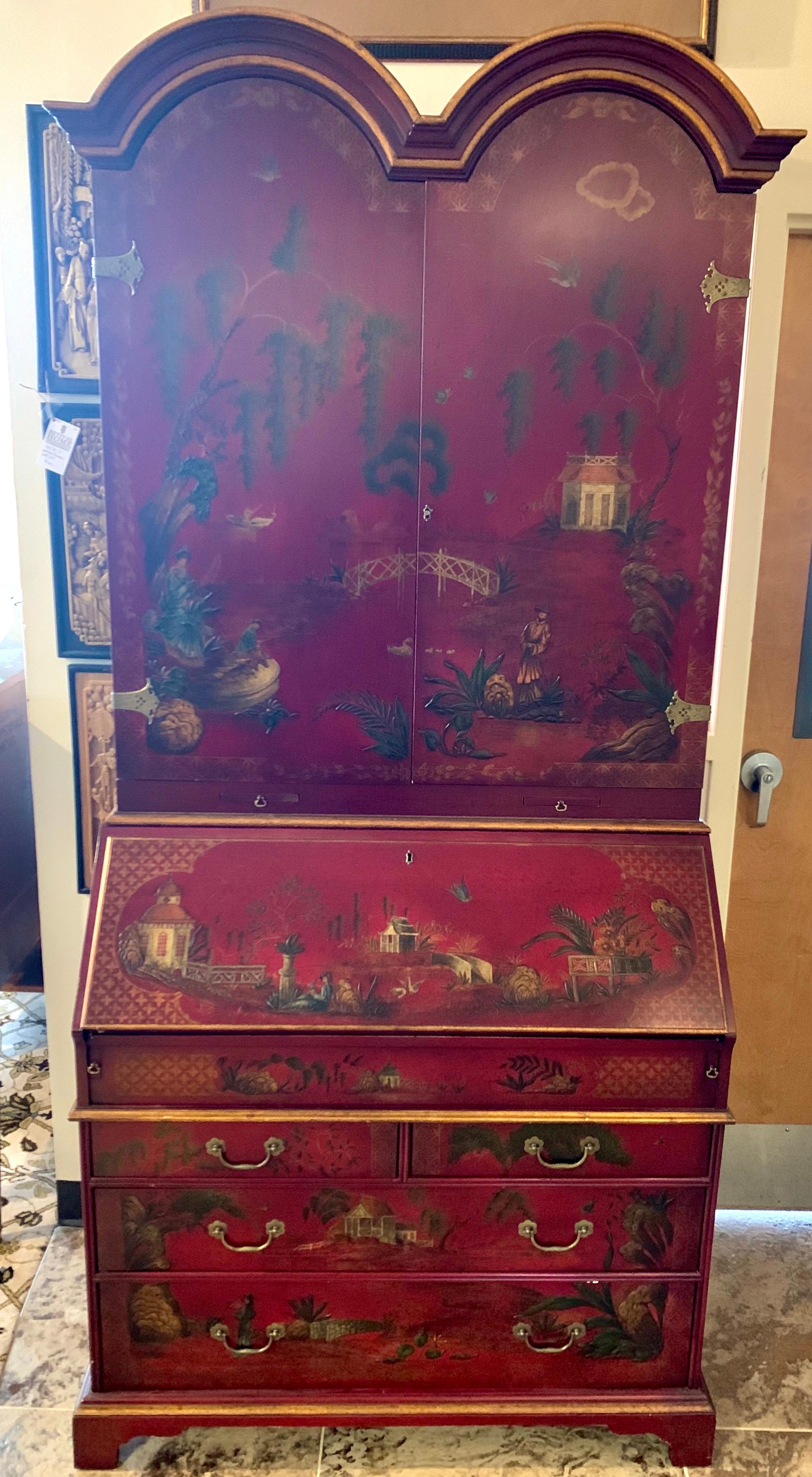 Rare signed John Widdicomb red chinoiserie midcentury secretary desk that comes in two pieces, a top and a bottom. It features multiple drawers and compartments, including a hidden storage compartment
that slides open and close. It also is fully
