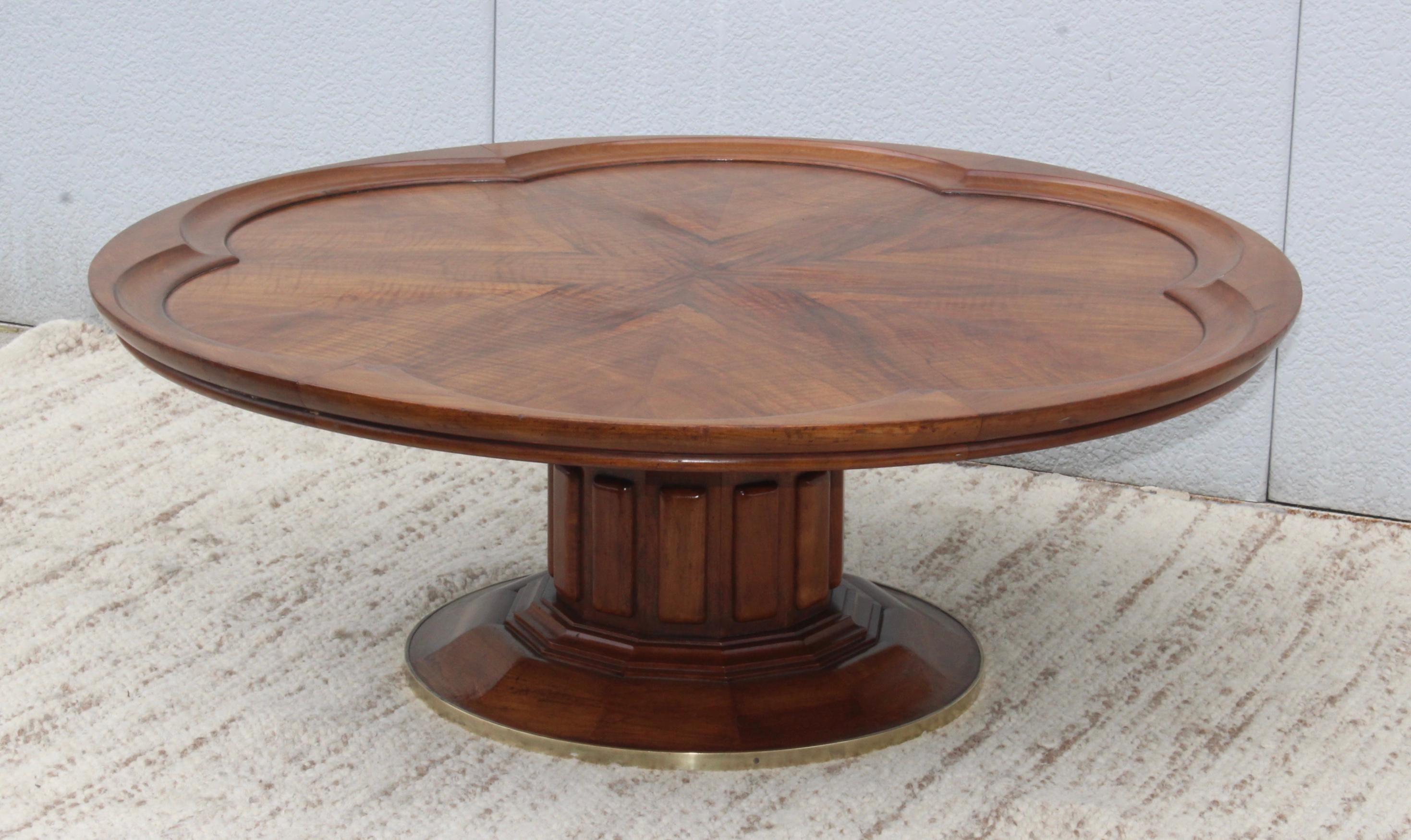 1960s large walnut coffee table with brass detail.