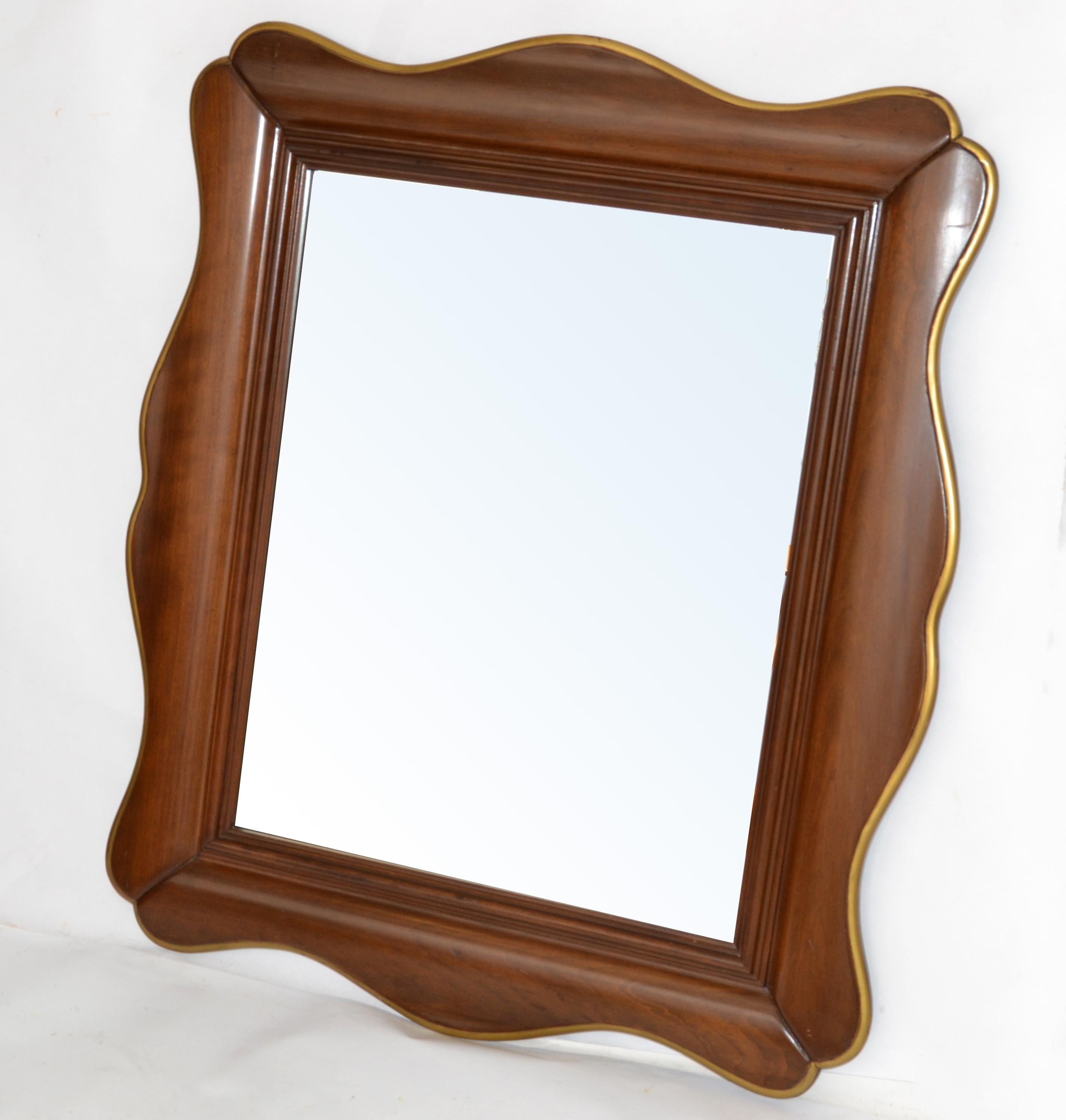 Original John Widdicomb Mid-Century Modern Scalloped hand carved walnut wall mirror with giltwood accent.
Made in America circa 1970.
Makers Mark on the back.
Mirror Size: 17 x 21 inches.
This is rare to find vintage mirror from the Widdicomb