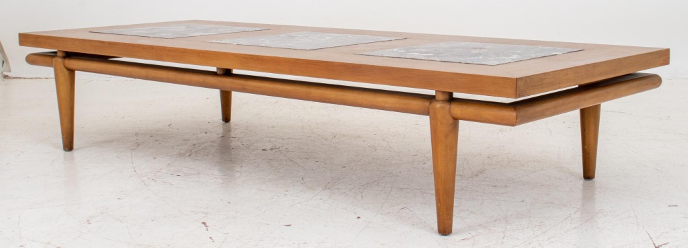 Large John Widdicomb low table made of walnut grain with three thick marble inserts, floating top raised on four tapered legs. 14