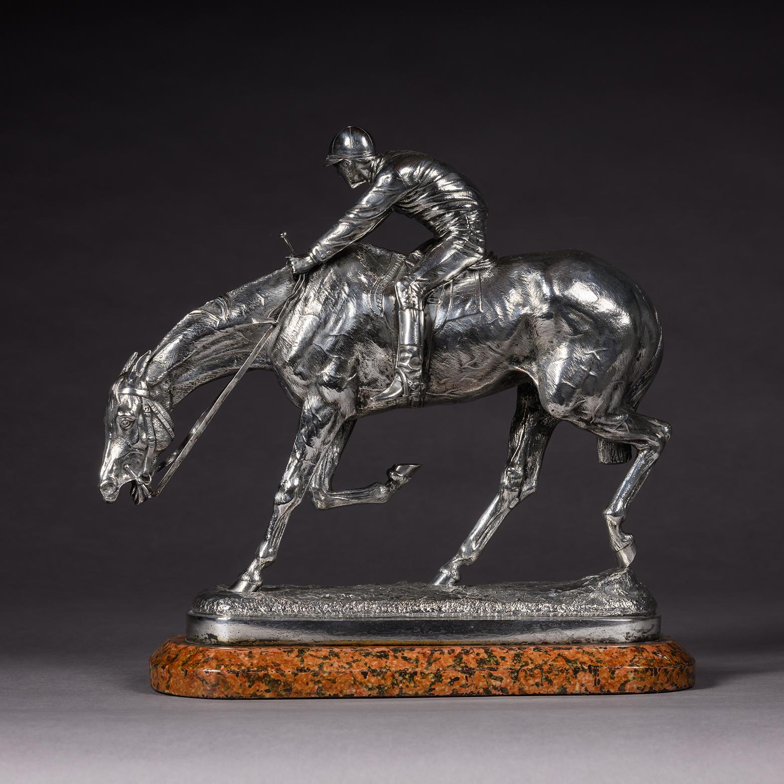 John Willis-Good (British, 1845 - 1879)
‘After The Race’.

A Silvered Bronze Equestrian Group Cast By Elkington & Co, Birmingham. 

Depicting a racehorse with jockey up, at the dynamic conclusion of a race, standing on a grassy naturalistic base and
