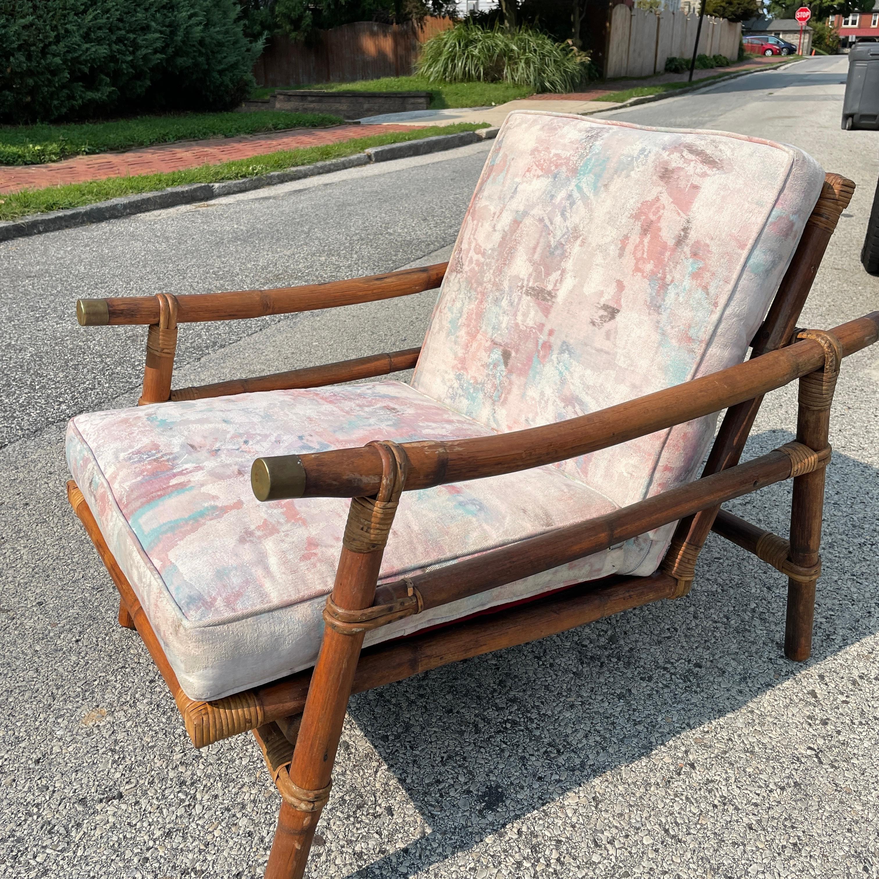 A vintage Far Horizons rattan lounge chair by John Wisner for Ficks Reed. The bamboo has been re-oiled making it look like new. The cane backing of the seat is in good condition with only minor wear. The cushions are soft and clean. A great piece