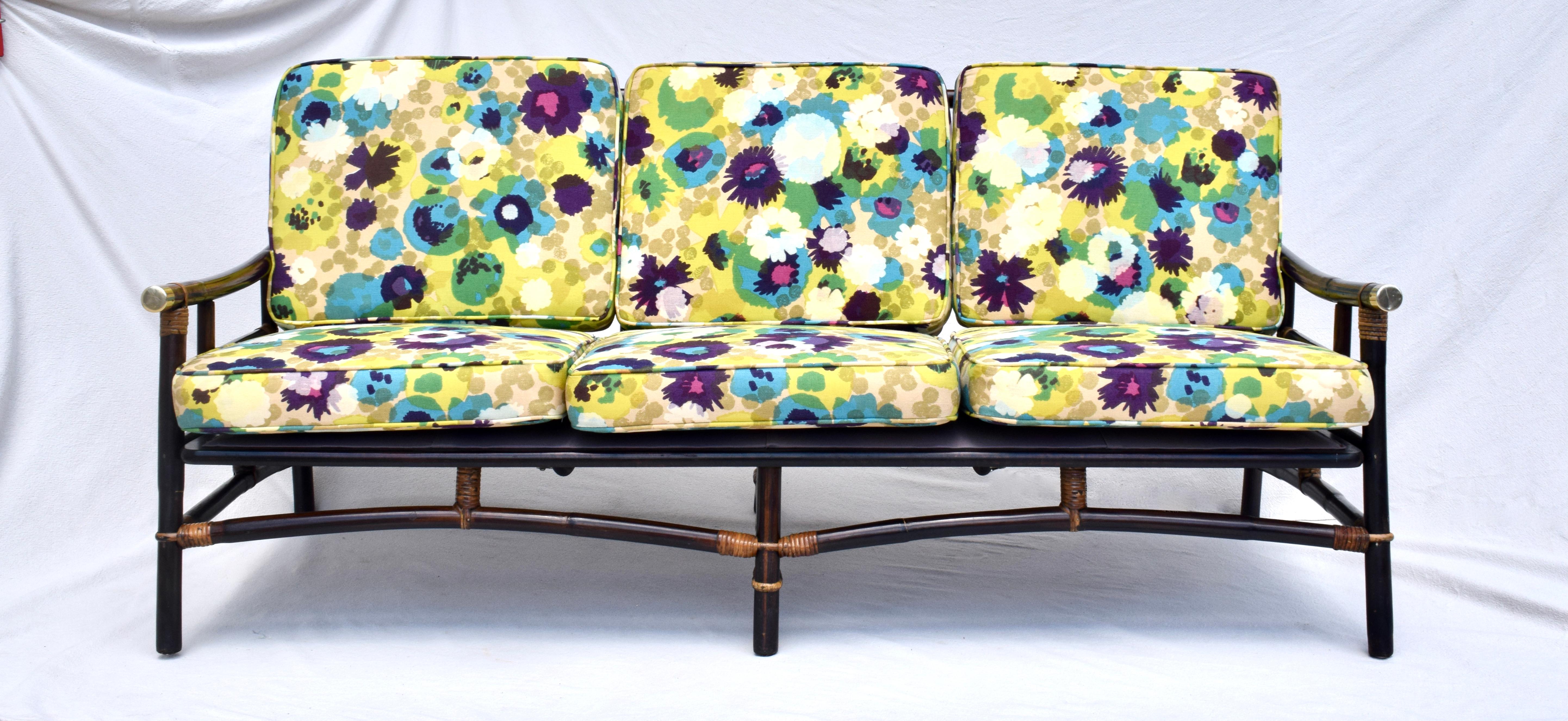 1950's John Wisner Ficks Reed Far Horizons rattan sofa with new wrapped foam inserts to the original custom cushions in vibrant Jack Lenor Larsen floral upholstery.  In overall exceptional condition, the beautifully maintained cushions have always