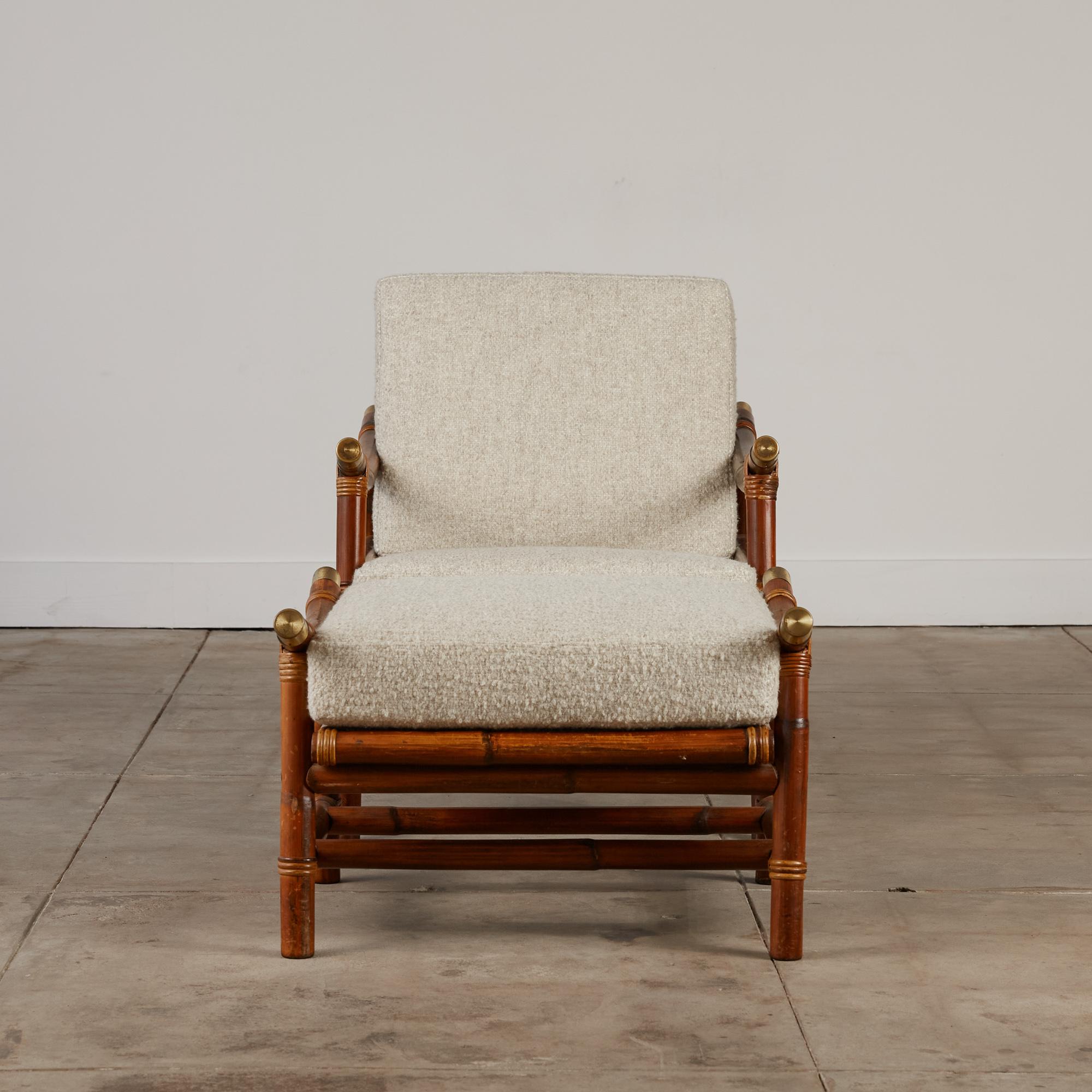 A rattan lounge chair and ottoman by John B. Wisner for Ficks Reed, USA, c.1950s. The frame is made of shaped bamboo and rattan woven around the joints. Brass metal caps dress the ends of the chair's arms adding a little glamour. The cushions are