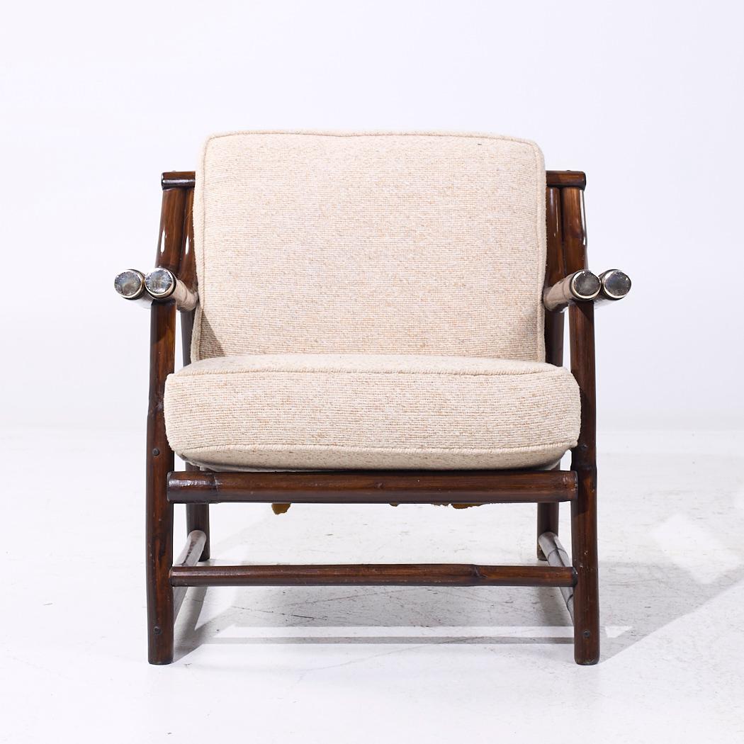 John Wisner for Ficks Reed Mid Century Bamboo Lounge Chair

Each chair measures: 28.25 wide x 33 deep x 29 inches high, with a seat height of 16.5 and arm height/chair clearance of 21.75 inches

We take our photos in a controlled lighting studio to