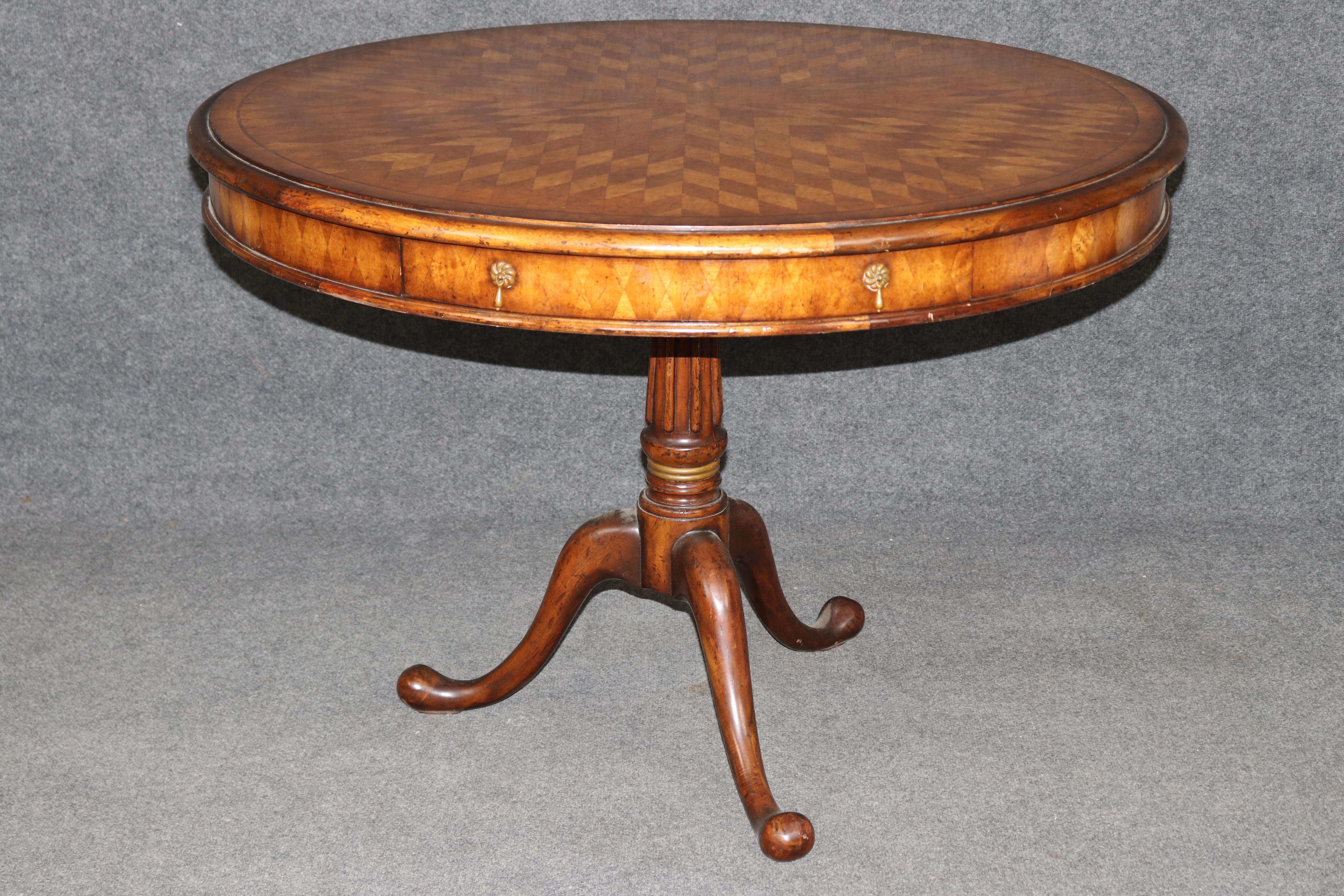Dimensions - H: 30 in W: 42 in D: 42 in 

A refined statement of traditional British craftsmanship, this English walnut parquetry center table is by Jonathan Charles Fine Furniture—a brand known for its dedication to historical accuracy, rich