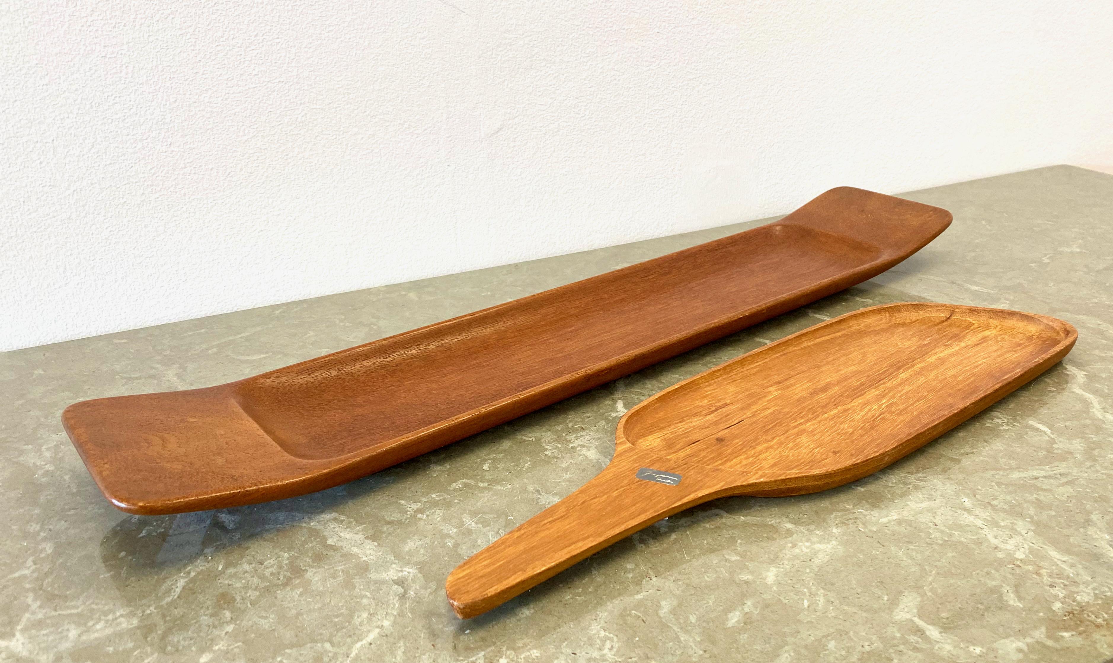 Set of 2 trays by Swedish handicraft master Johnny Mattsson. Measurements for the large tray, the smaller one measures 42,5 cm (length), 11,8 cm (width), 1,7 cm (height). Large one with carved mark JM, small one with sticker. No dent or damages to