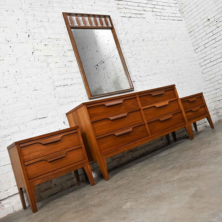 Fabulous vintage Mid-Century Modern Johnson Carper Fashion Trend 4 Piece walnut bedroom set including a 6 drawer dresser, mirror, and pair of nightstands. Beautiful condition, keeping in mind that these are vintage and not new so will have signs of