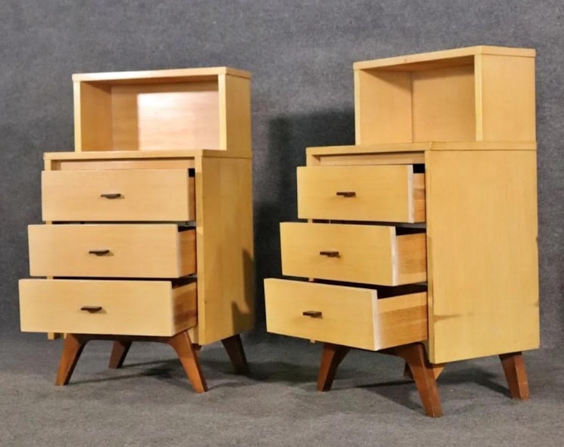 Mid-century modern end tables by Johnson Carper, featuring contrasting wood, curved legs and three drawer storage.
Please confirm location NY or NJ