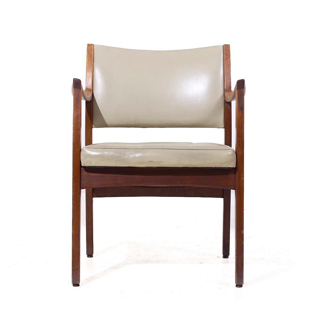 Johnson Chair Co Mid Century Walnut Arm Chair

This chair measures: 23.5 wide x 23.5 deep x 31.25 inches high, with a seat height of 18 and arm height/chair clearance of 26.75 inches

We take our photos in a controlled lighting studio to show as