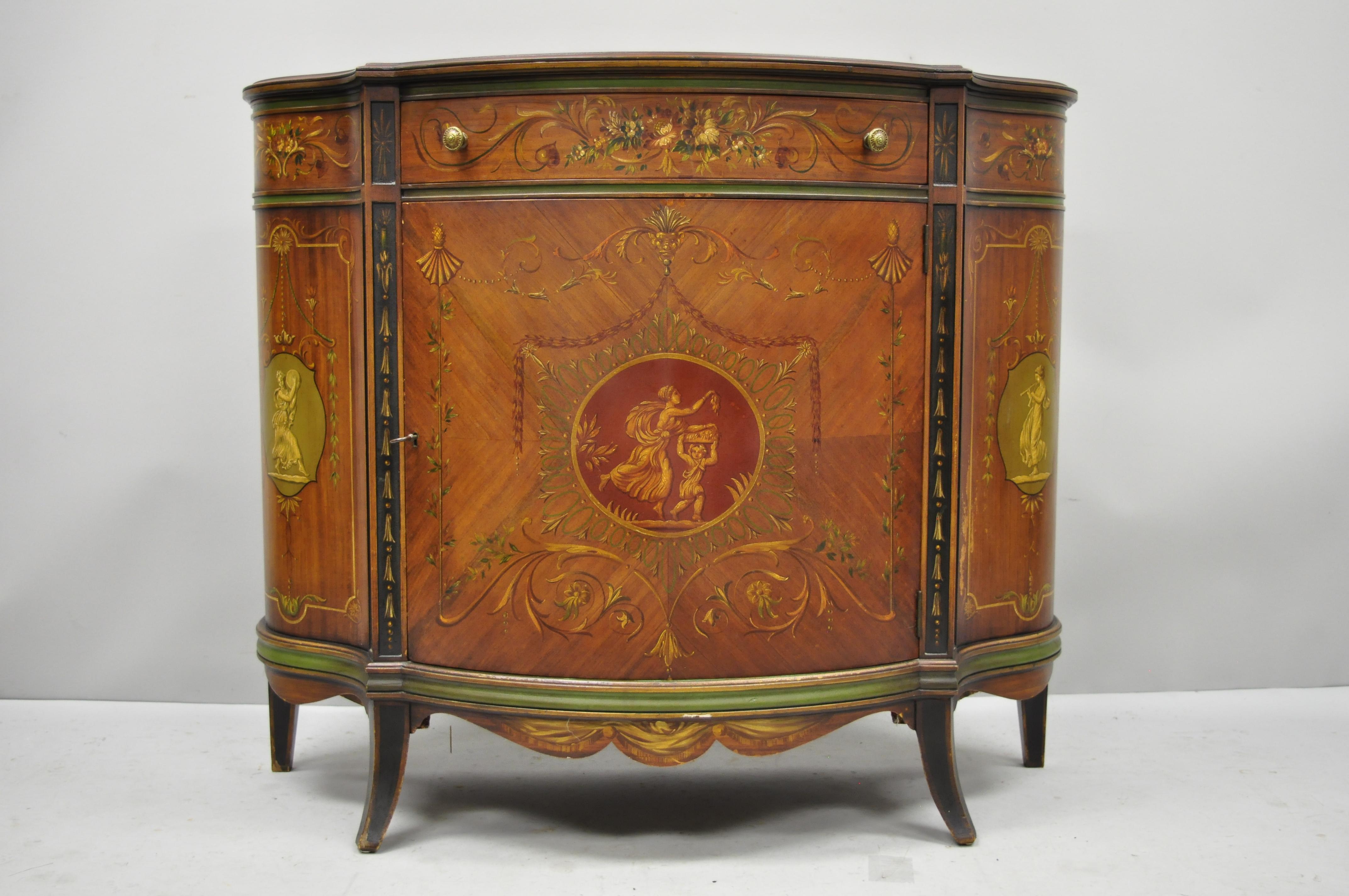 Johnson Handley Adams style paint decorated demilune Bombe commode. Item features hand painted details throughout, demilune form, original label, 1 dovetailed drawer, quality American craftsmanship, great style and form, circa early 20th century.