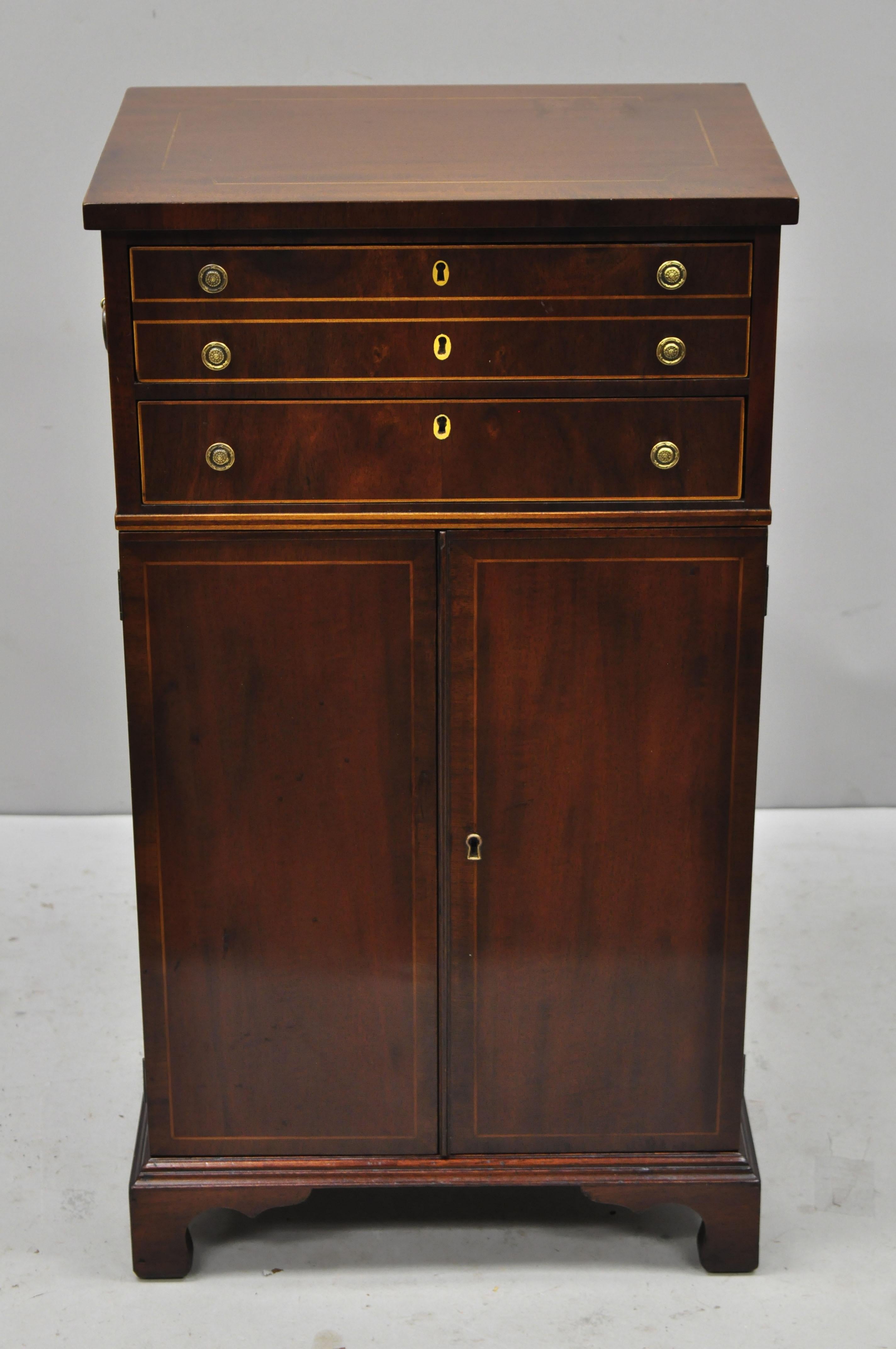 Antique Johnson Handley American Museum Collection Sheraton Mahogany Small Cabinet. Item features satinwood inlays, solid wood construction, beautiful wood grain, 2 swing doors, working lock and key, 2 dovetailed drawers, solid brass hardware, very