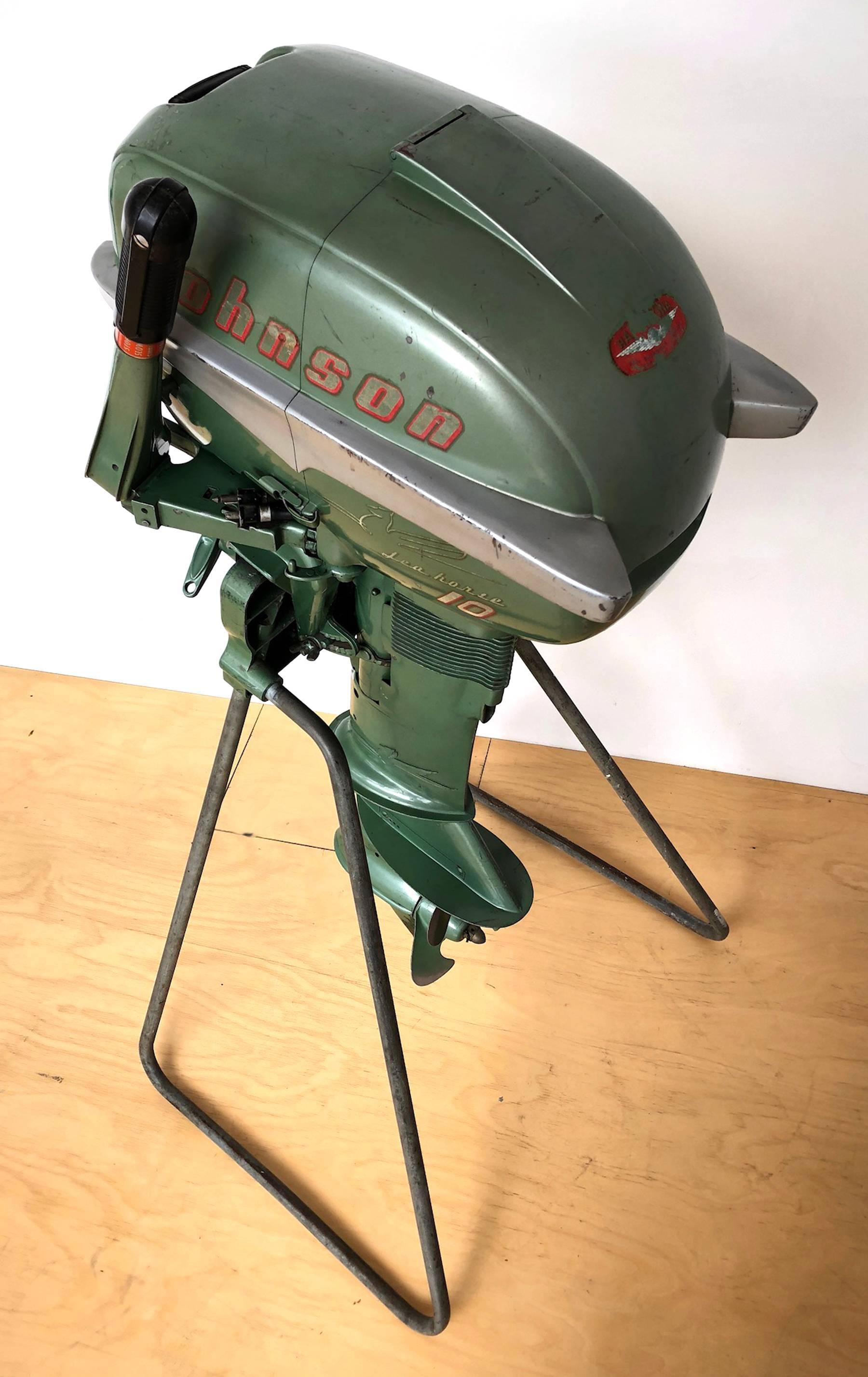 Johnson outboard motor from the 1950s. Johnson motor stand is included in the price. As shown mounted: 47.5