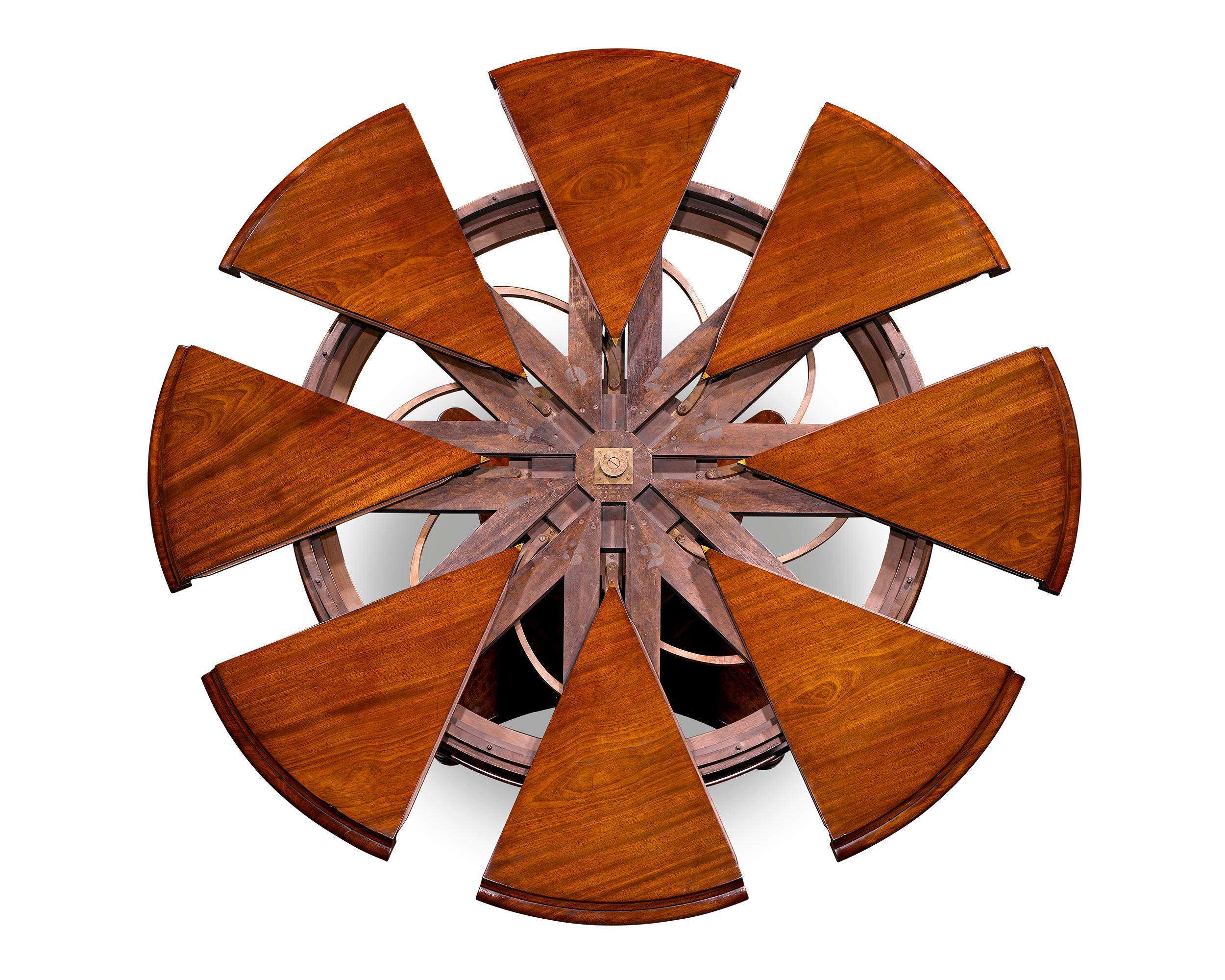 Extremely rare and important, this English mahogany circular extension dining table was designed and patented by Robert Jupe and retailed by the company he co-founded, Johnstone, Jupe & Co. One of only a handful known, this table illustrates