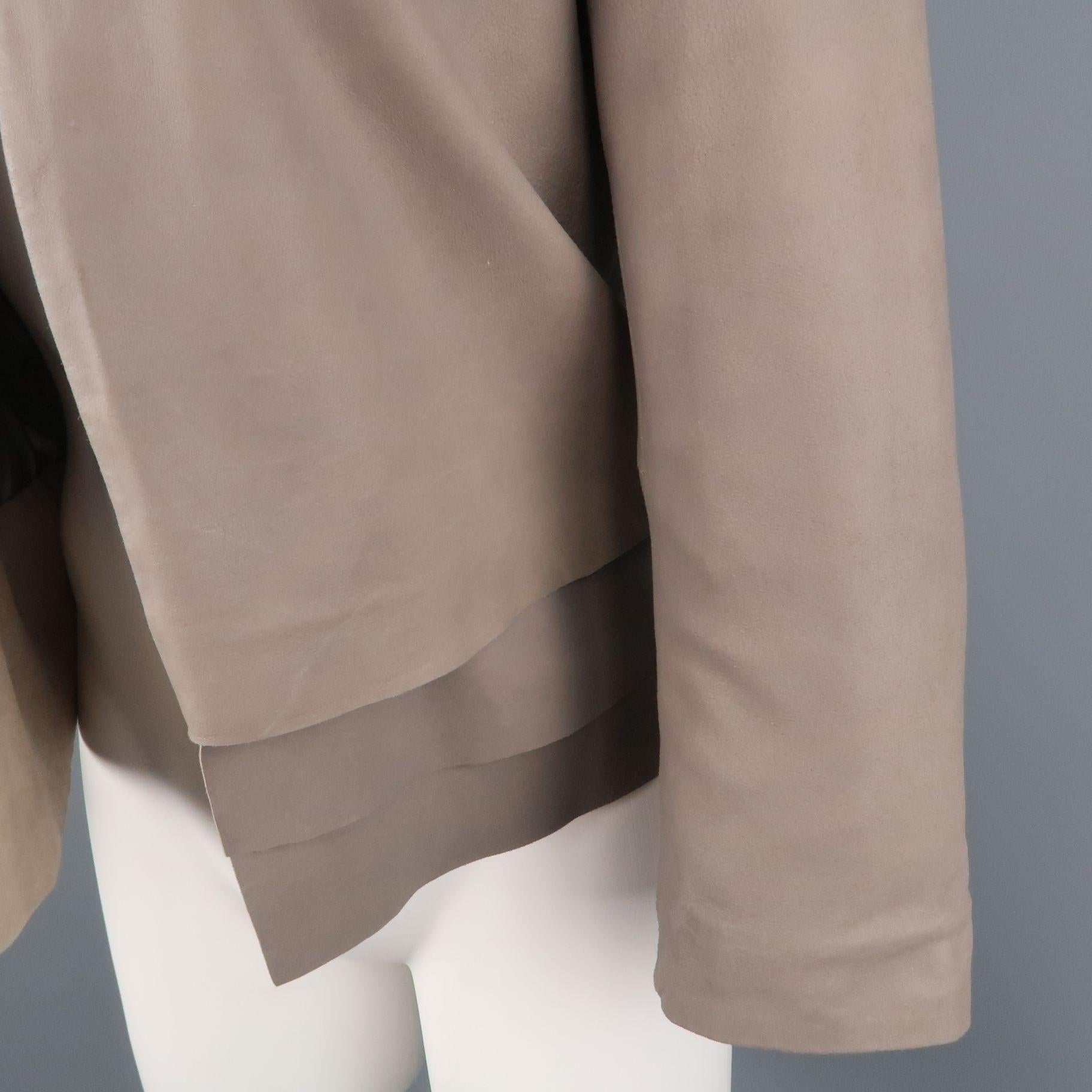 JOIE open front jacket comes in light weight taupe gray leather with a collarless round neckline, and layered hem. Fading and discolorations throughout. As-is.
 
Good Pre-Owned Condition.
Marked: XS
 
Measurements:
 
Shoulder: 13.5 in.
Chest: 34