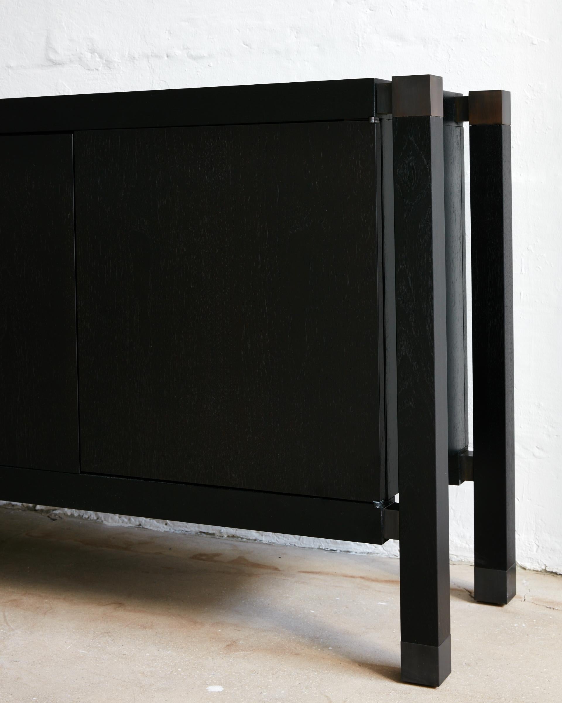 Measurements
15 D x 78 L x 30 H inches

Material Specifications
Frame: Blackened oak, walnut, bleached oak, or white lacquer
Metal: Brushed brass, blackened brass, bronze, brushed nickel

Notes
Finishes and dimensions may be customized.